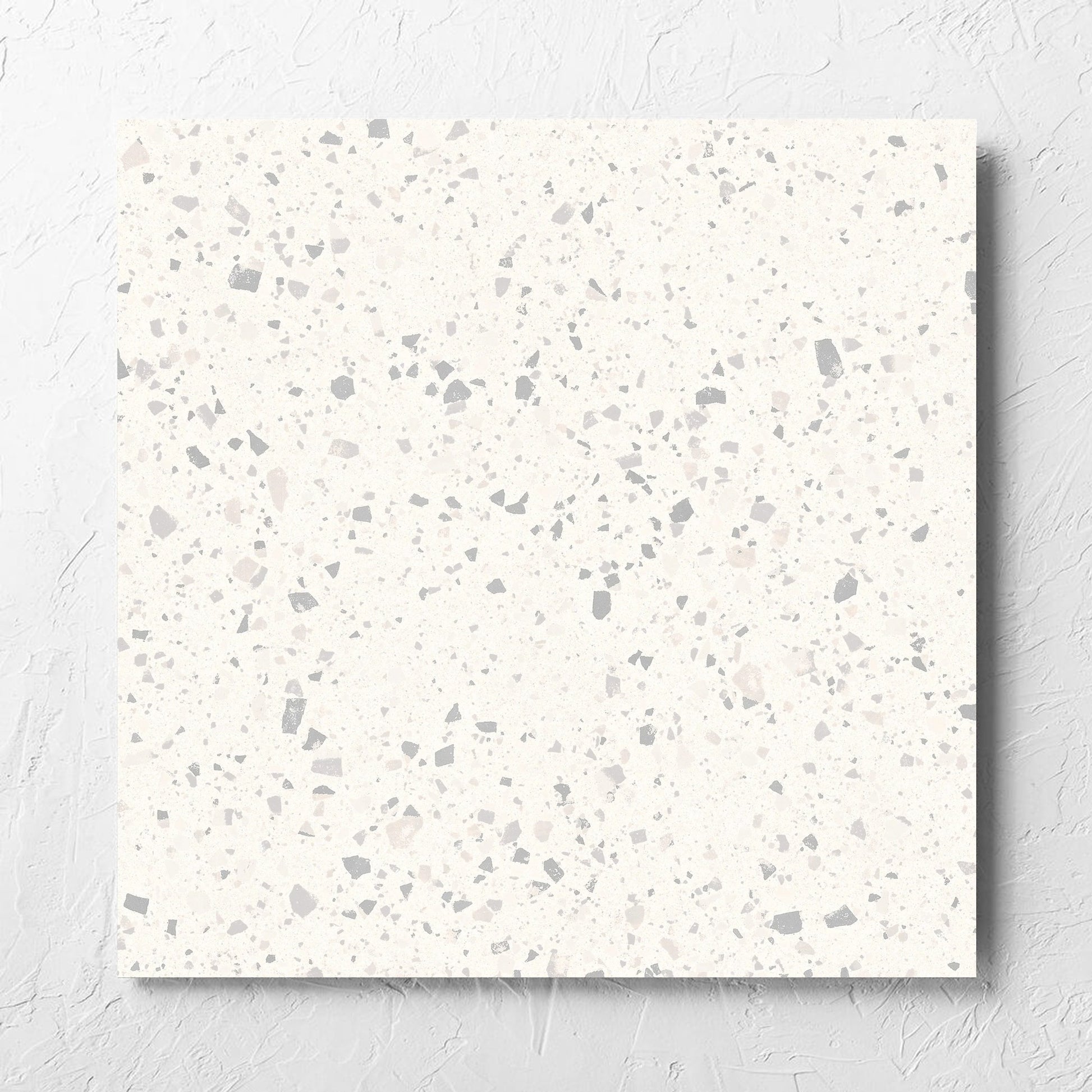 C Venice 600x600 Matt Zinc Terrazzo Look Rectified tile laid flat on a white rendered wall, showing the tile surface
