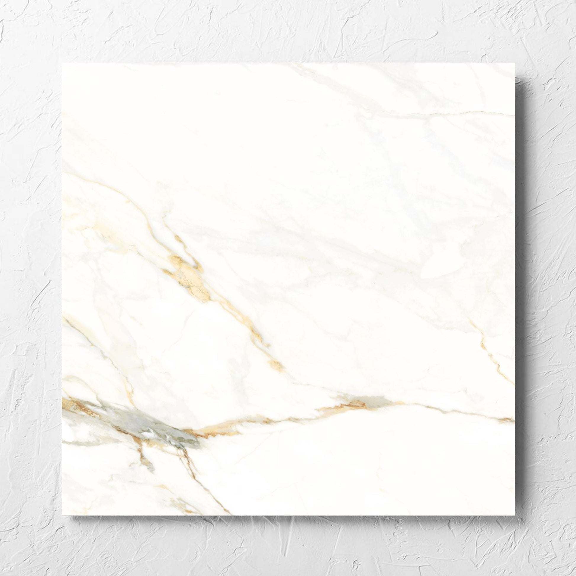 Calacatta Vagli Matt 600x600mm tile laid flat on a white rendered wall, showing the tile surface