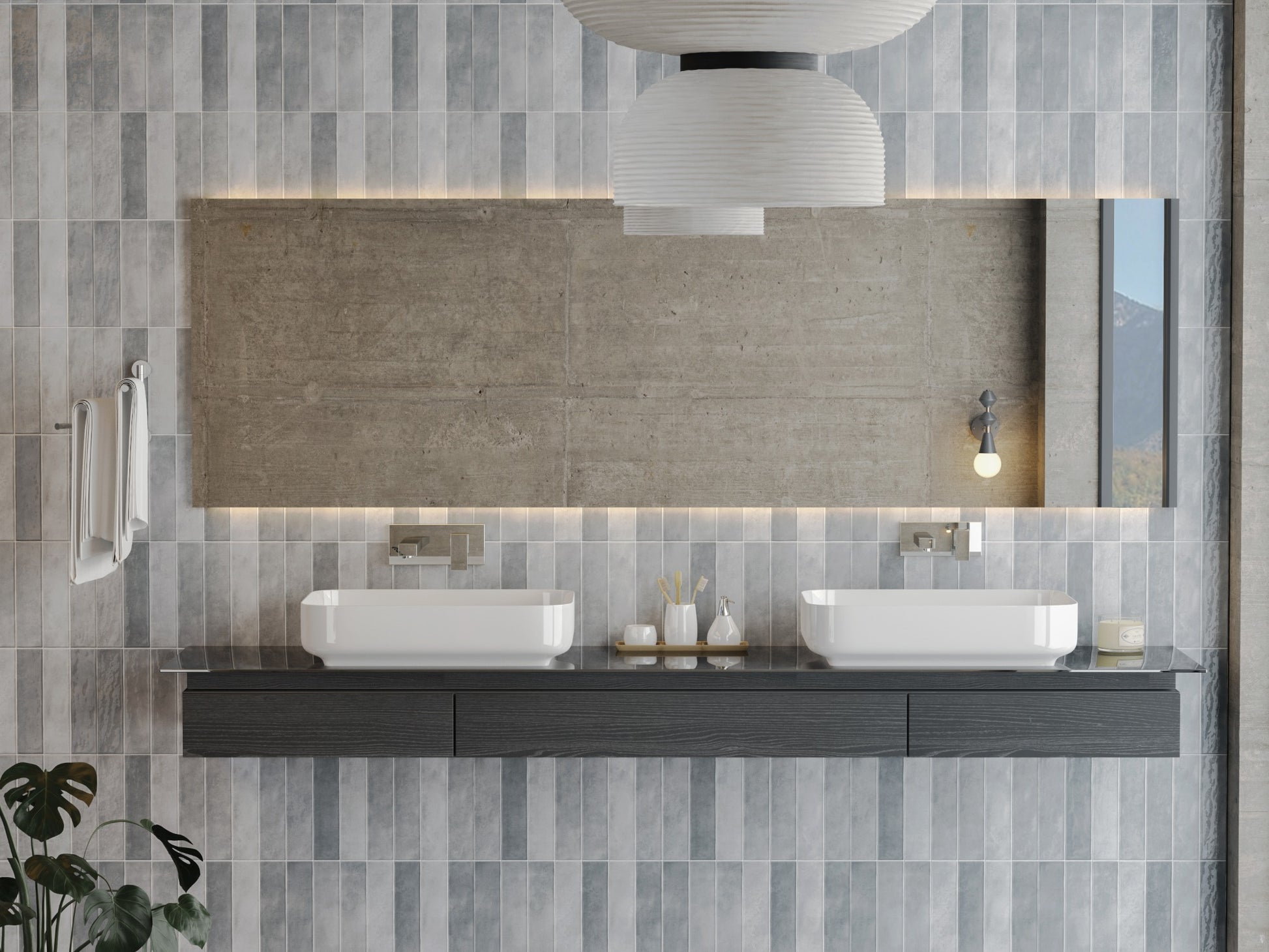 Caramela Grey Gloss 75x300mm tiles covering a modern bathroom wall behind a floating double vanity with vessel sinks and a large mirror.