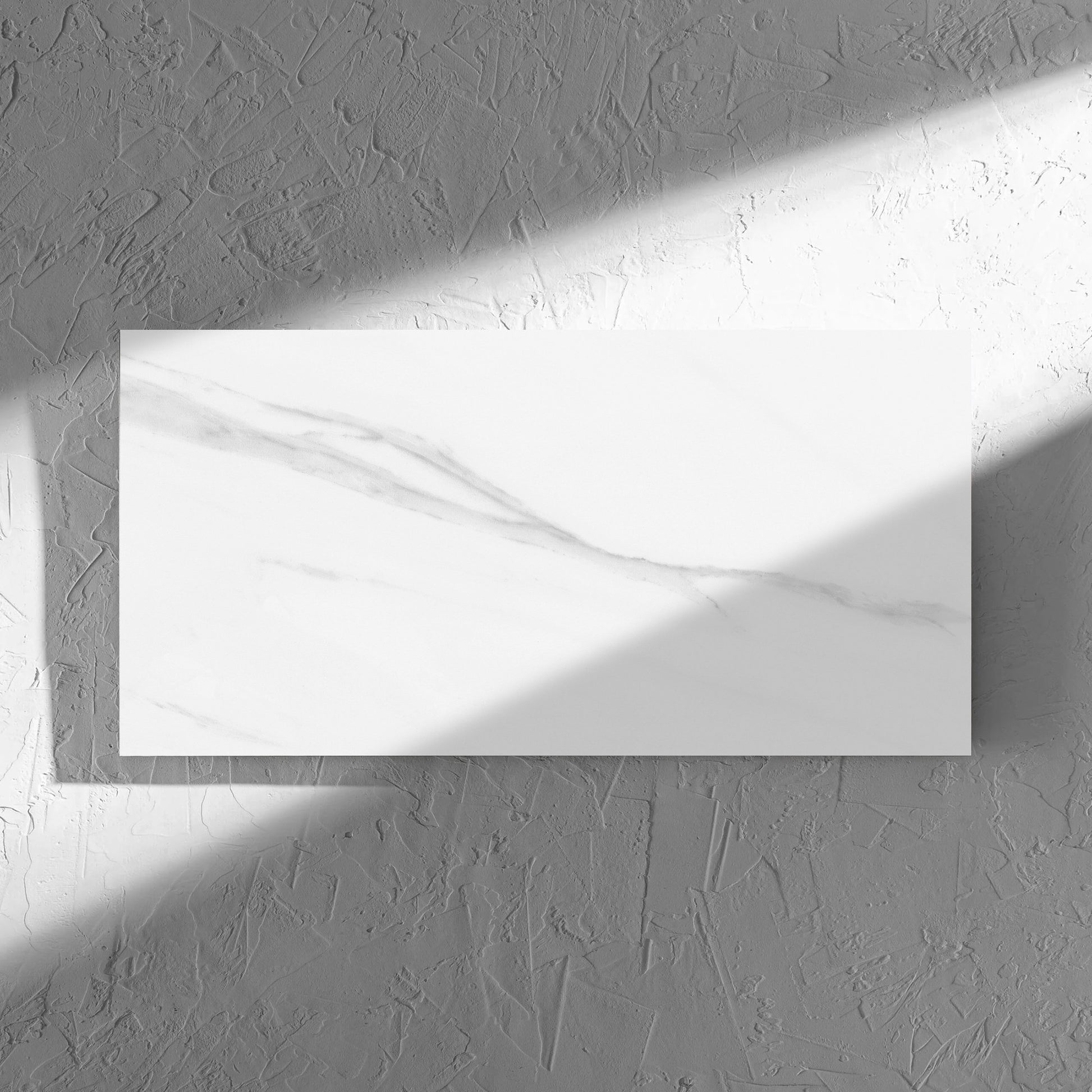 Carrara Bianco Gloss 300x600mm tile in soft natural window light, showing the gloss surface