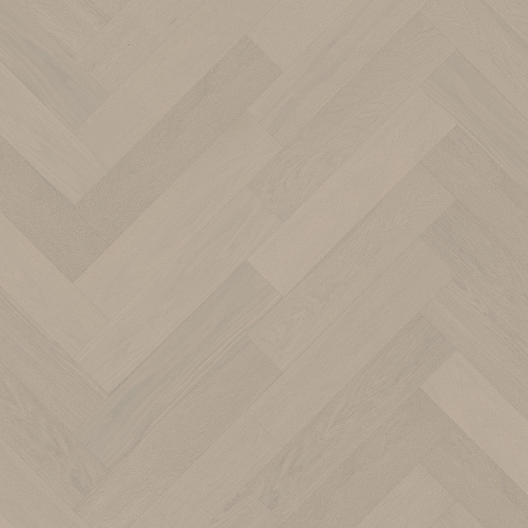 Close-up texture shot of Casper White iDesign Chevron Flooring 15/3mm showing a pale greige oak wood finish in a diagonal herringbone pattern.