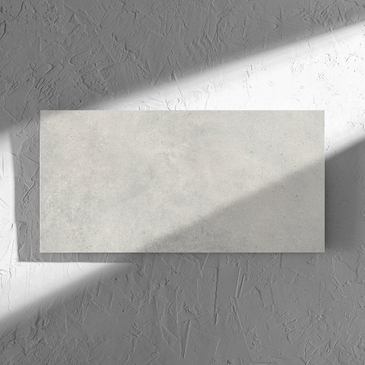 Cement Dark Grey Matt 300x600mm tile in soft natural window light, showing the matt surface