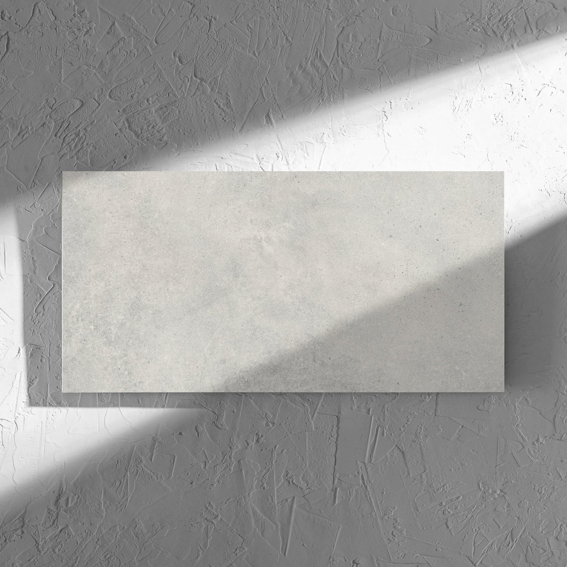 Cement Dark Grey Matt 300x600mm tile in soft natural window light, showing the matt surface