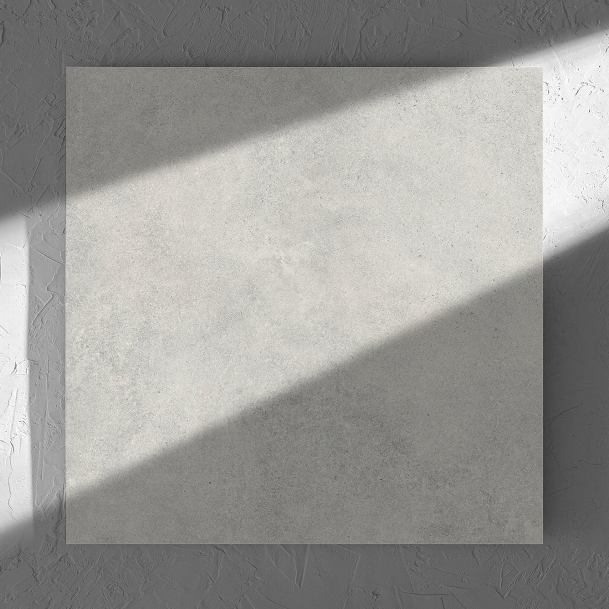 Cement Dark Grey Matt 600x600mm tile in soft natural window light, showing the matt surface