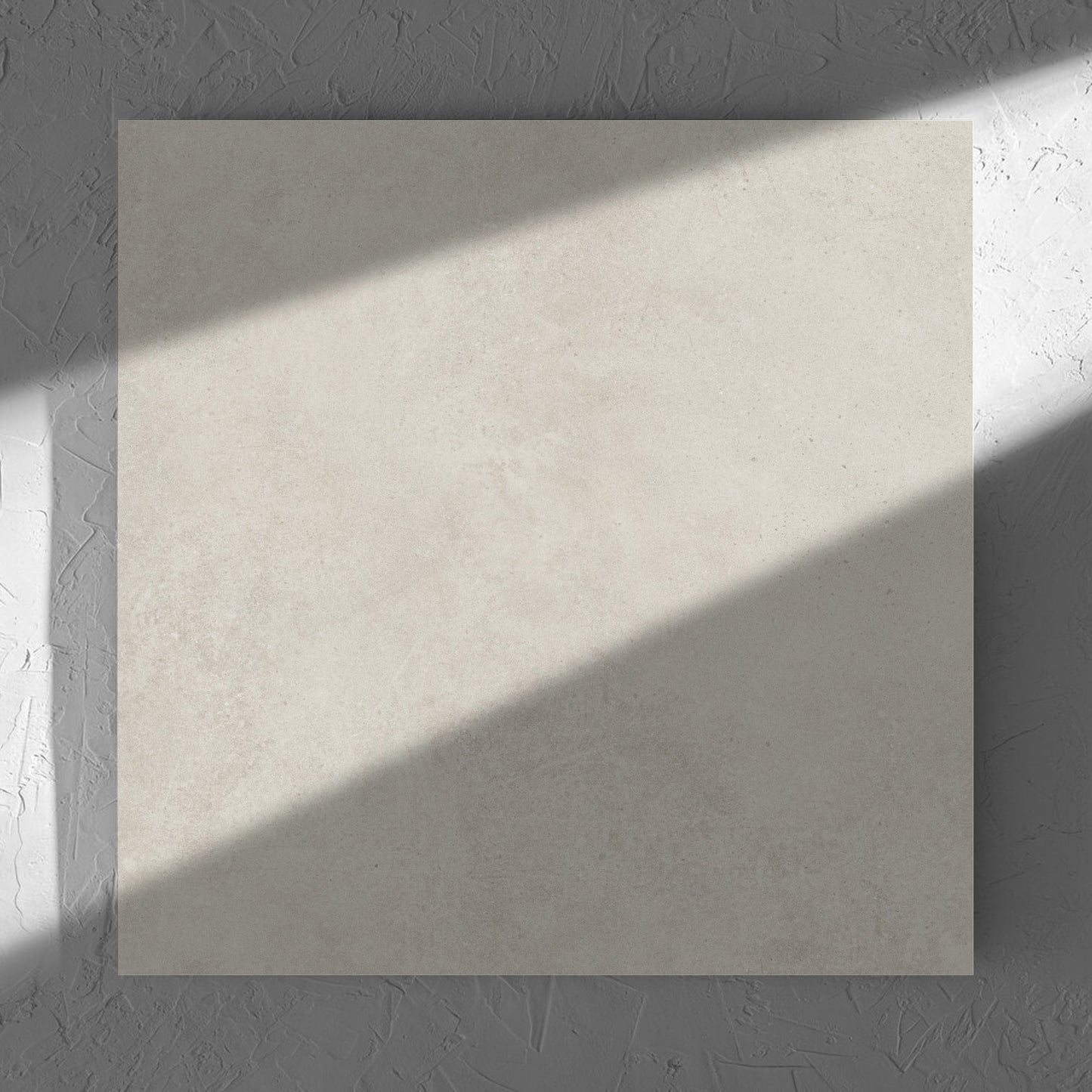 Cement Light Grey Matt 600x600mm tile in soft natural window light, showing the matt surface