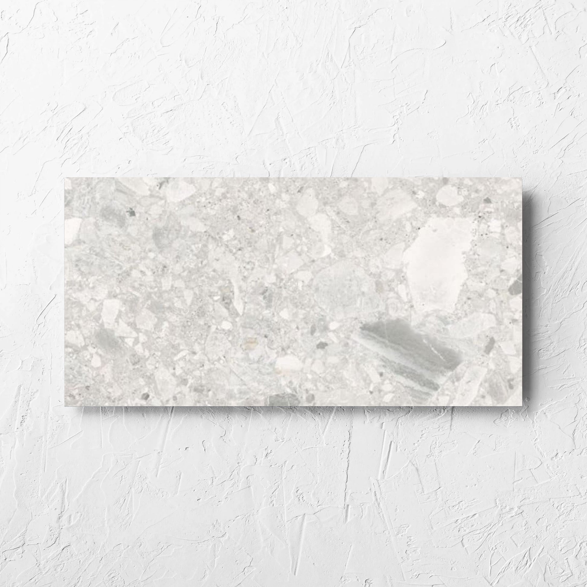 Ceppo Bianco InOut 300x600mm tile laid flat on a white rendered wall, showing the tile surface