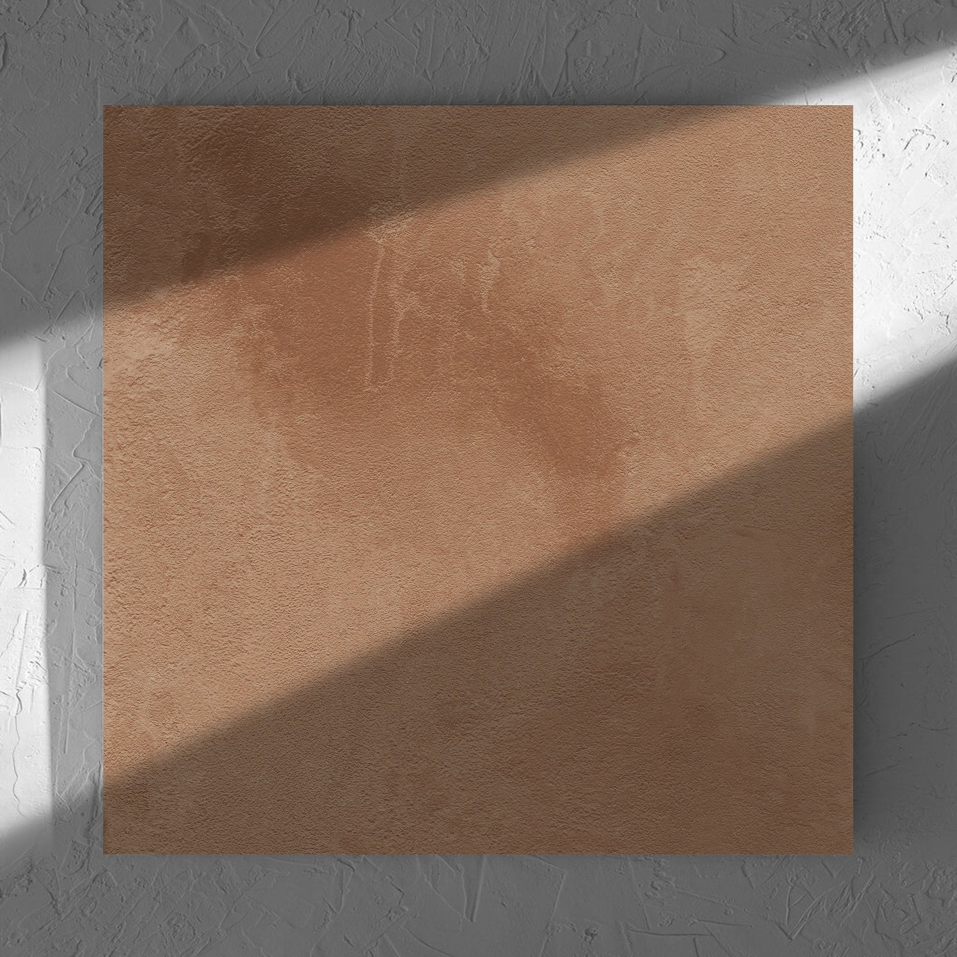 Clay Firenze Dark Terracotta 600x600mm tile in soft natural window light, showing the matt surface