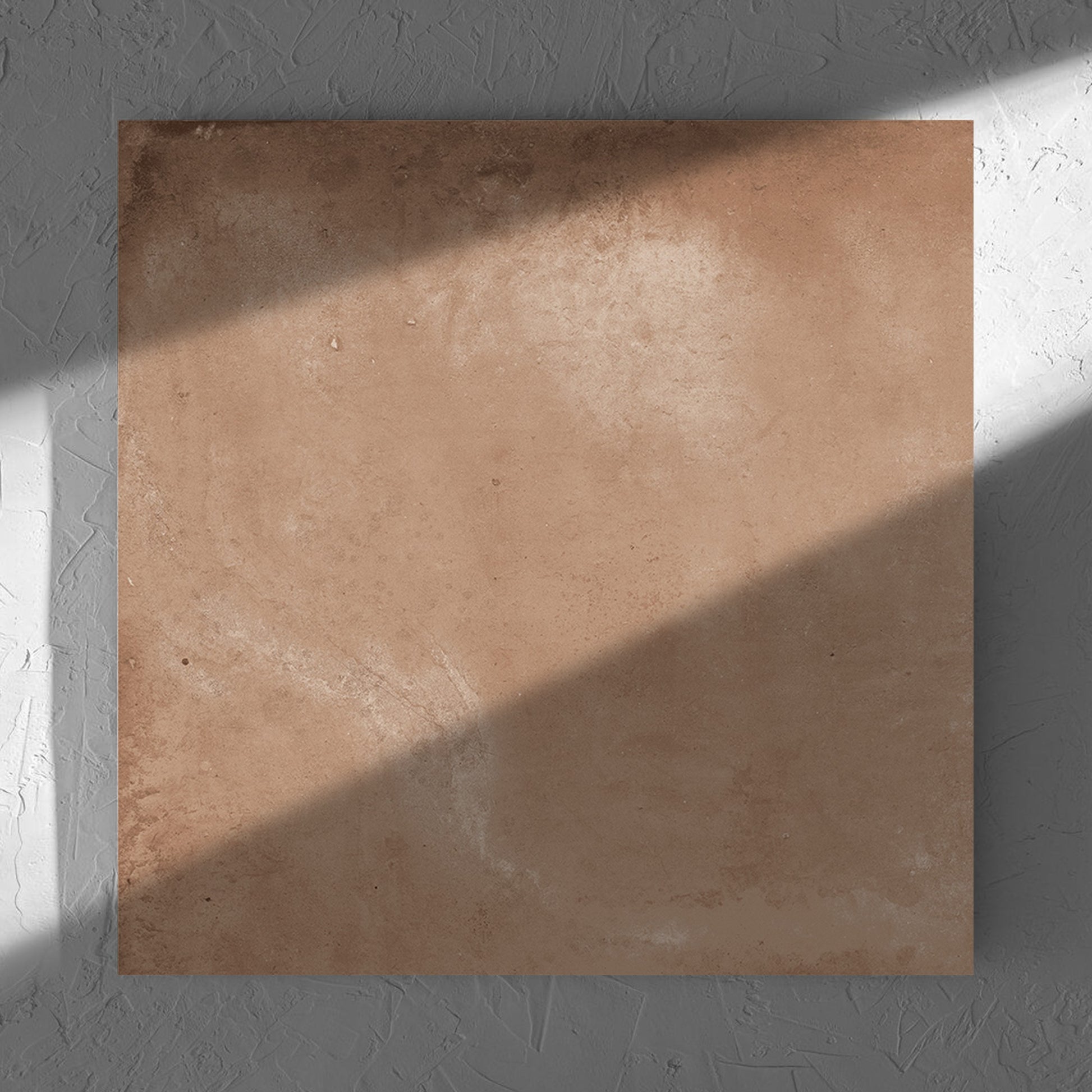 Clay Orvieto Light Terracotta 600x600mm tile in soft natural window light, showing the matt surface