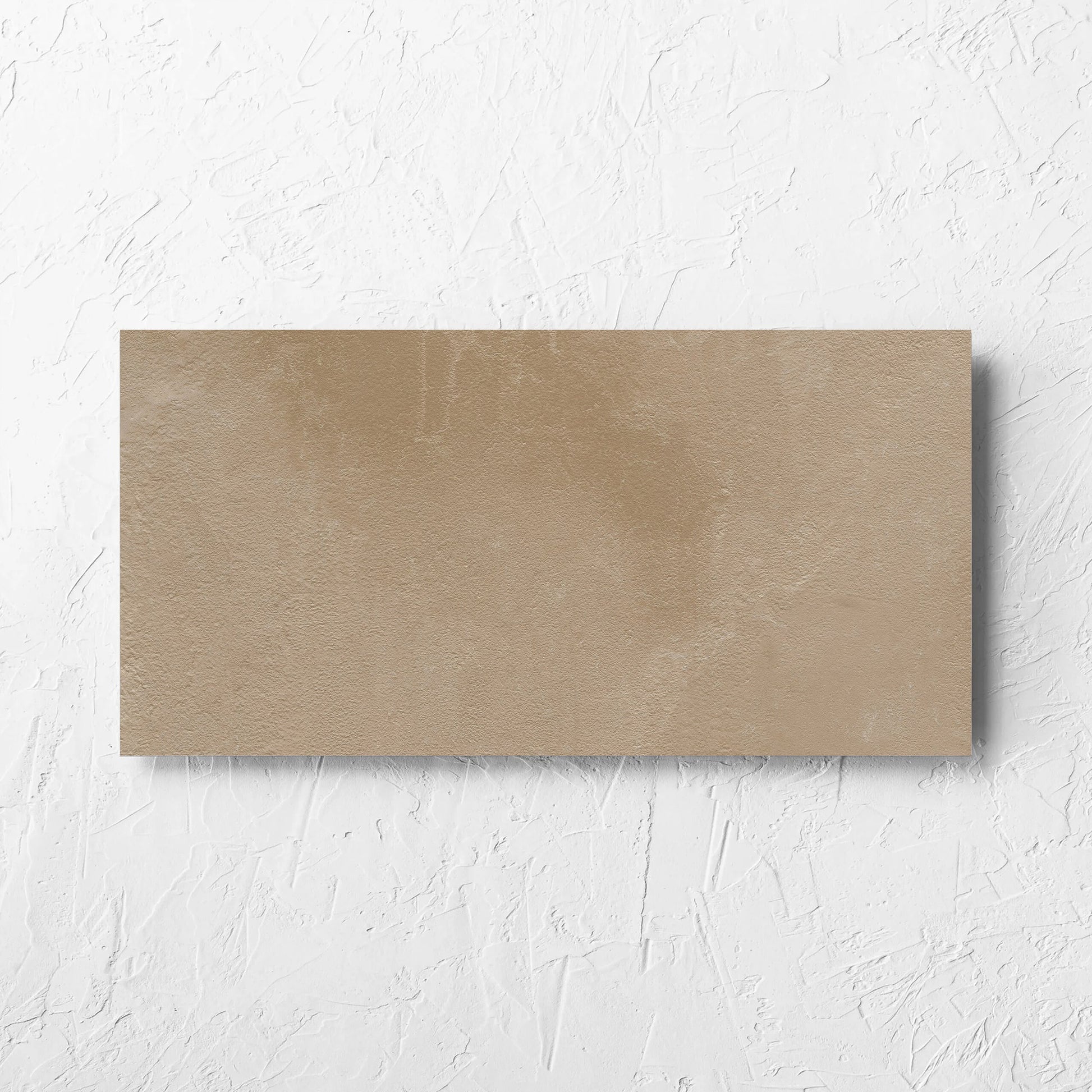 Clay Orvieto Light Terracotta 300x600mm tile laid flat on a white rendered wall, showing the matt surface