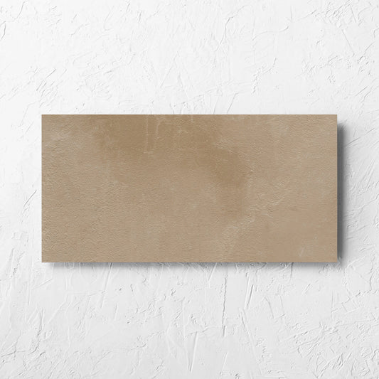 Clay Orvieto Light Terracotta 300x600mm tile laid flat on a white rendered wall, showing the matt surface