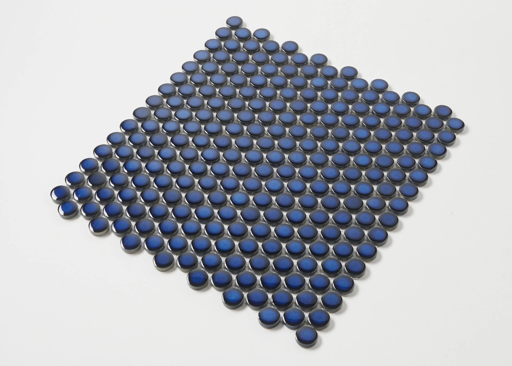 Cobalt Blue Gloss Diameter Glazed Porcelain Penny Round 19mm tiles arranged in a diamond shape, showcasing their glossy royal blue finish and circular form on a white background.