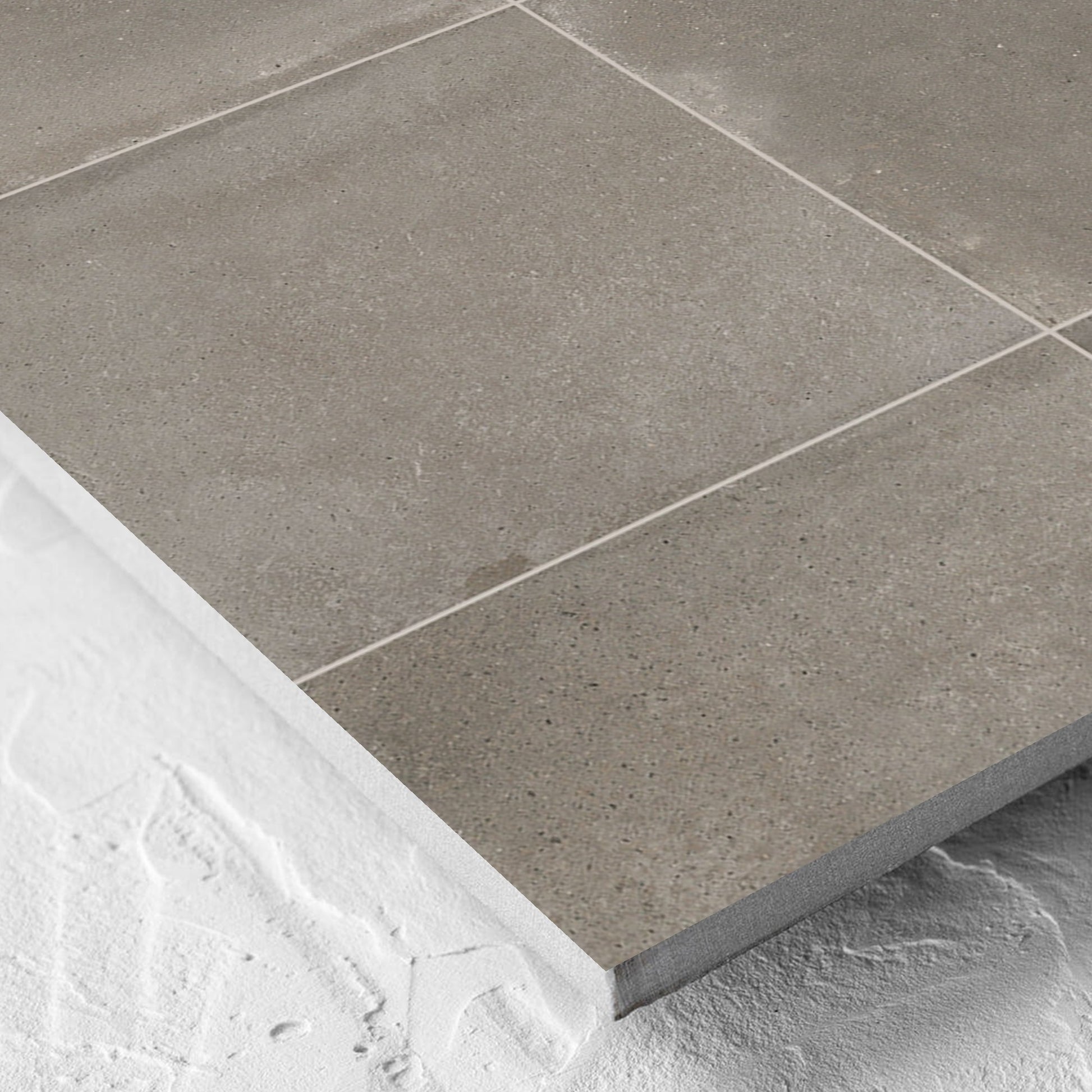 Corner close-up of the Cotto Concrete Matt 600x600mm tile showing the matt surface and the edge profile