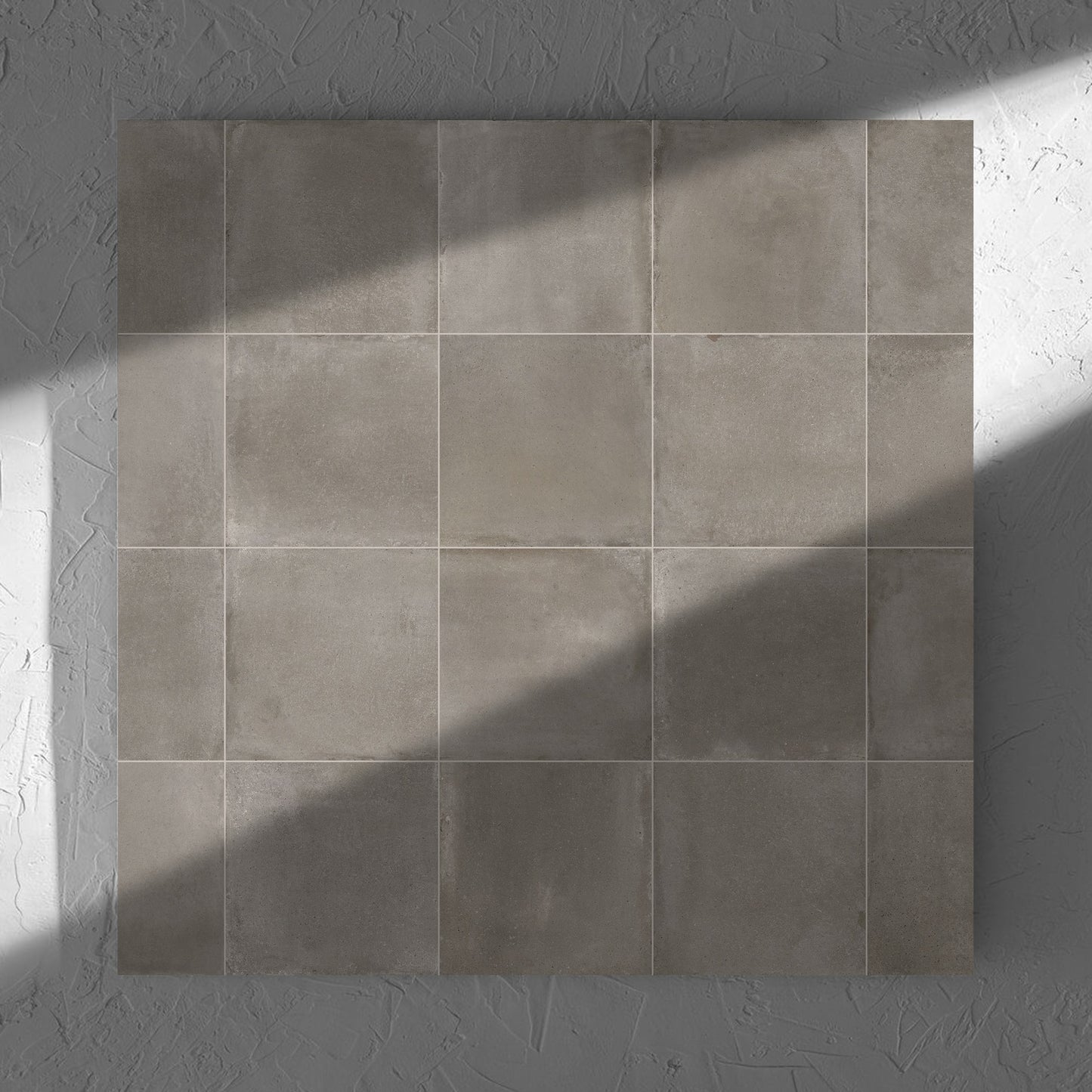 Cotto Concrete Matt 600x600mm tile in soft natural window light, showing the matt surface