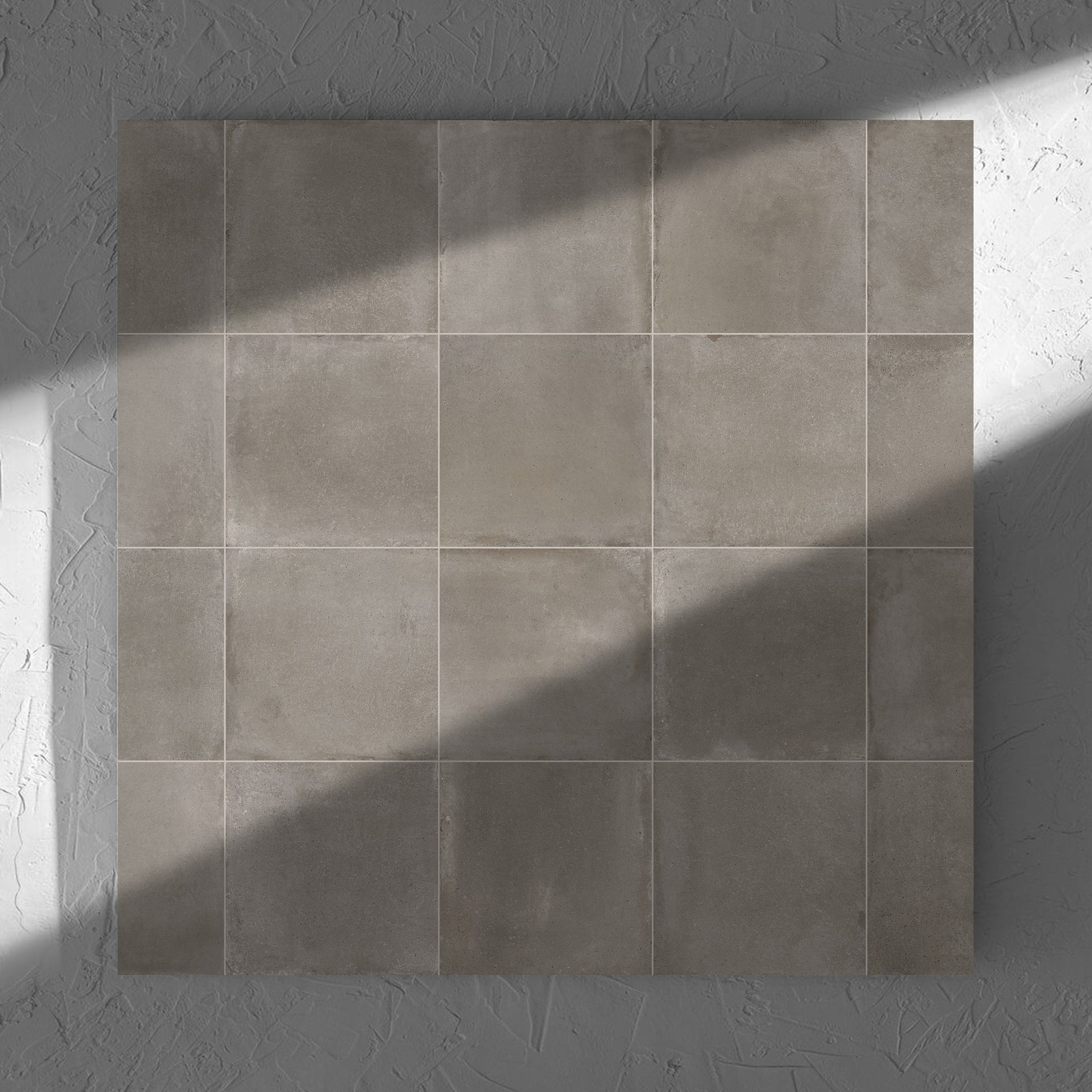 Cotto Concrete Matt 600x600mm tile in soft natural window light, showing the matt surface