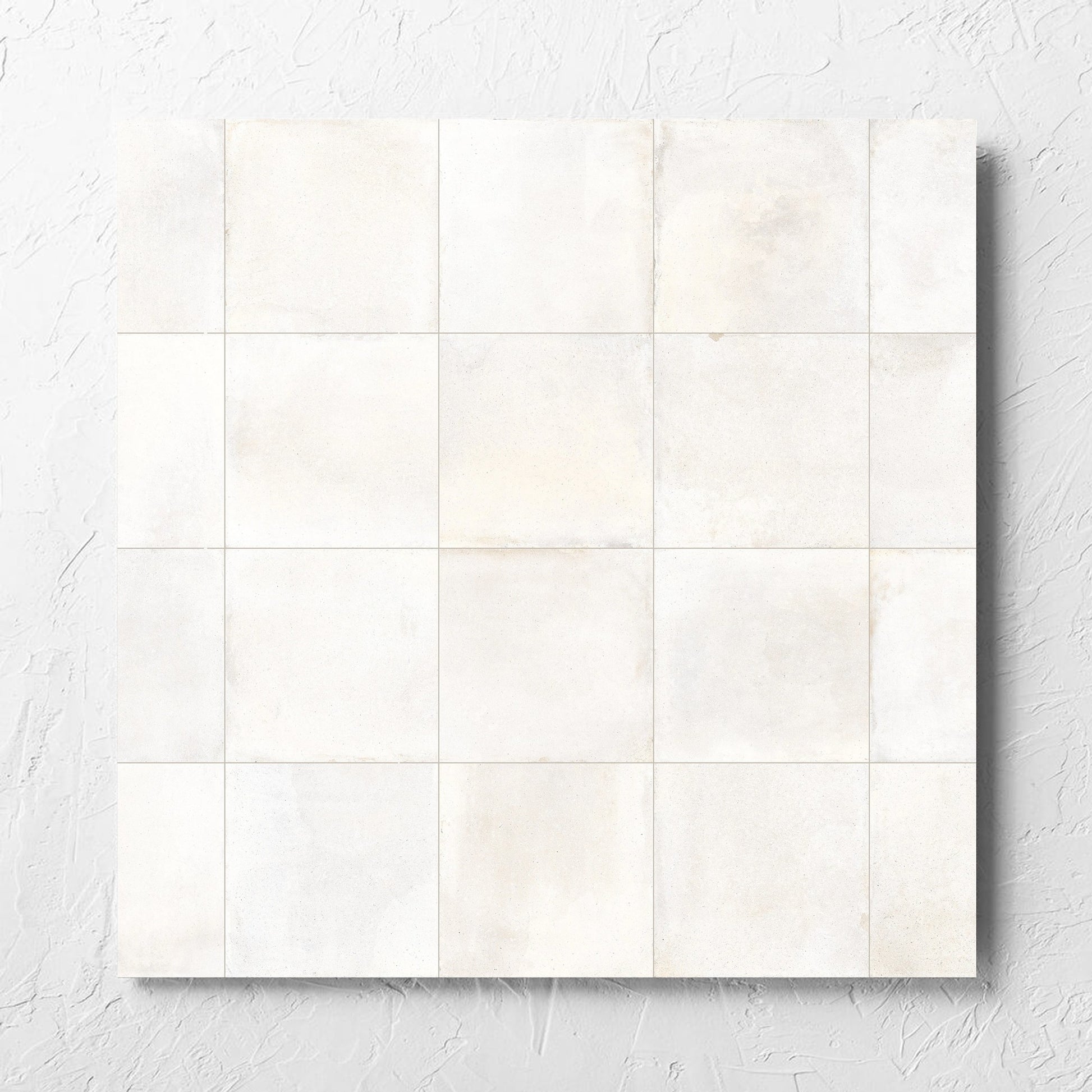 Cotto Ice Matt 600x600mm tile laid flat on a white rendered wall, showing the matt surface