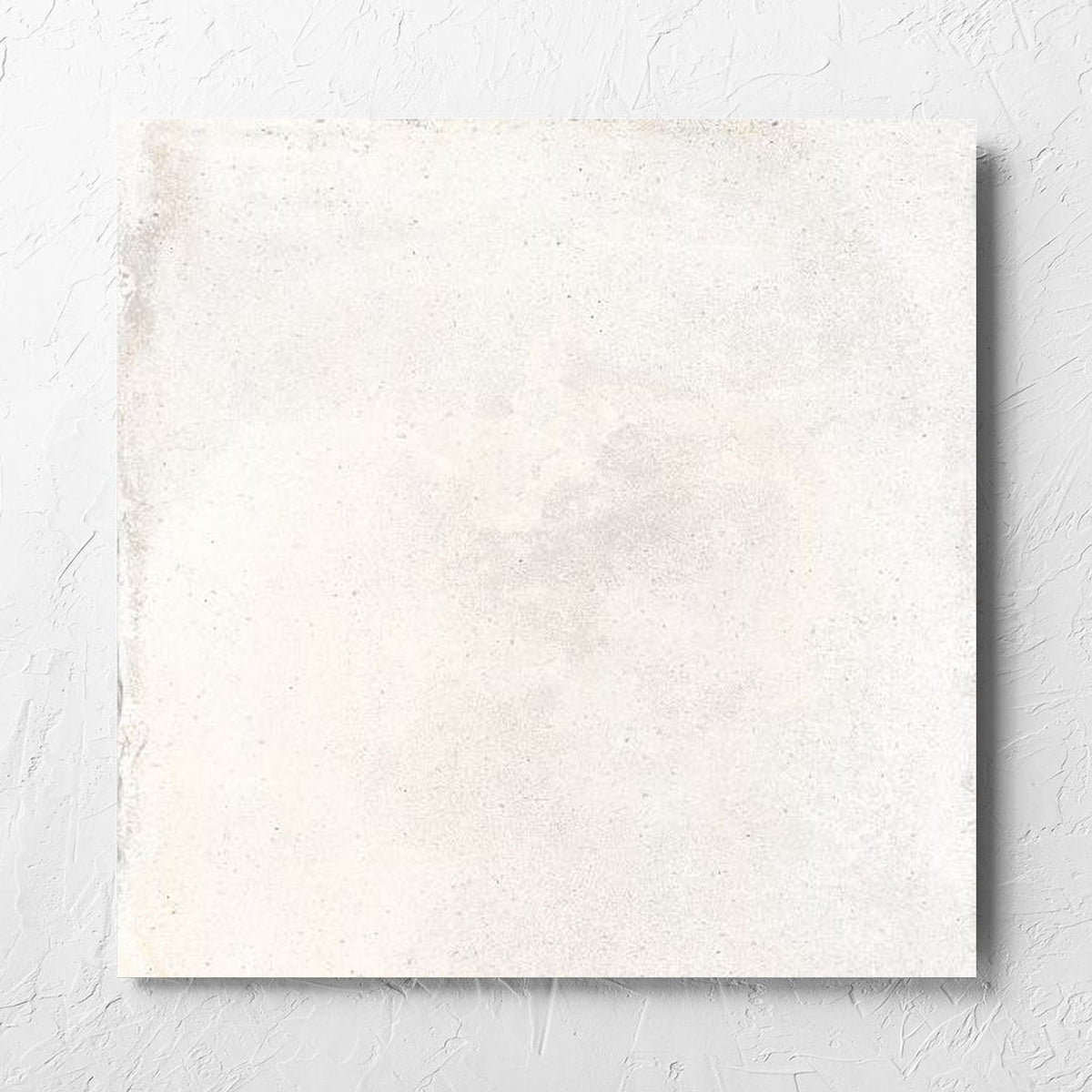 Cotto Ice Matt 600x600mm tile laid flat on a white rendered wall, showing the matt surface