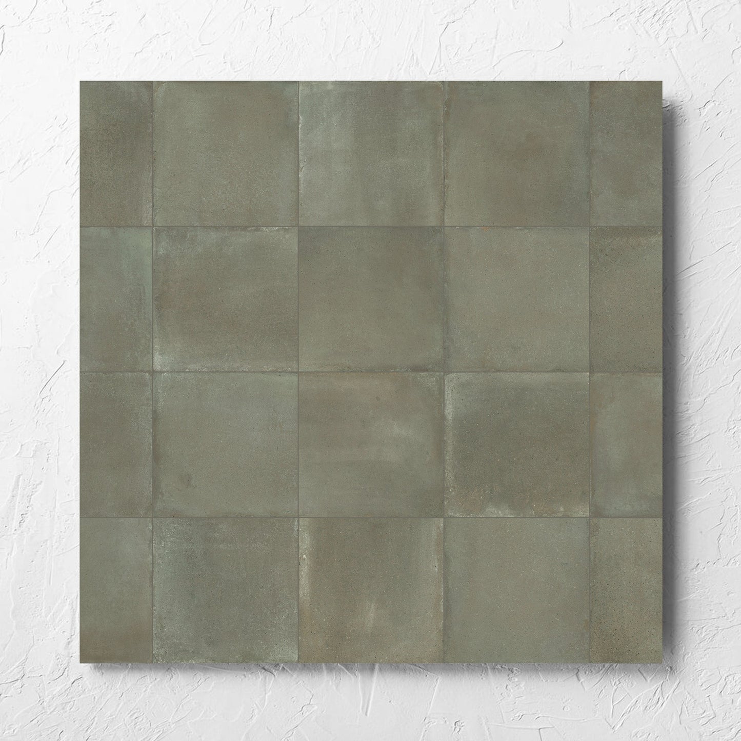 Cotto Khaki Matt 600x600mm tile laid flat on a white rendered wall, showing the matt surface