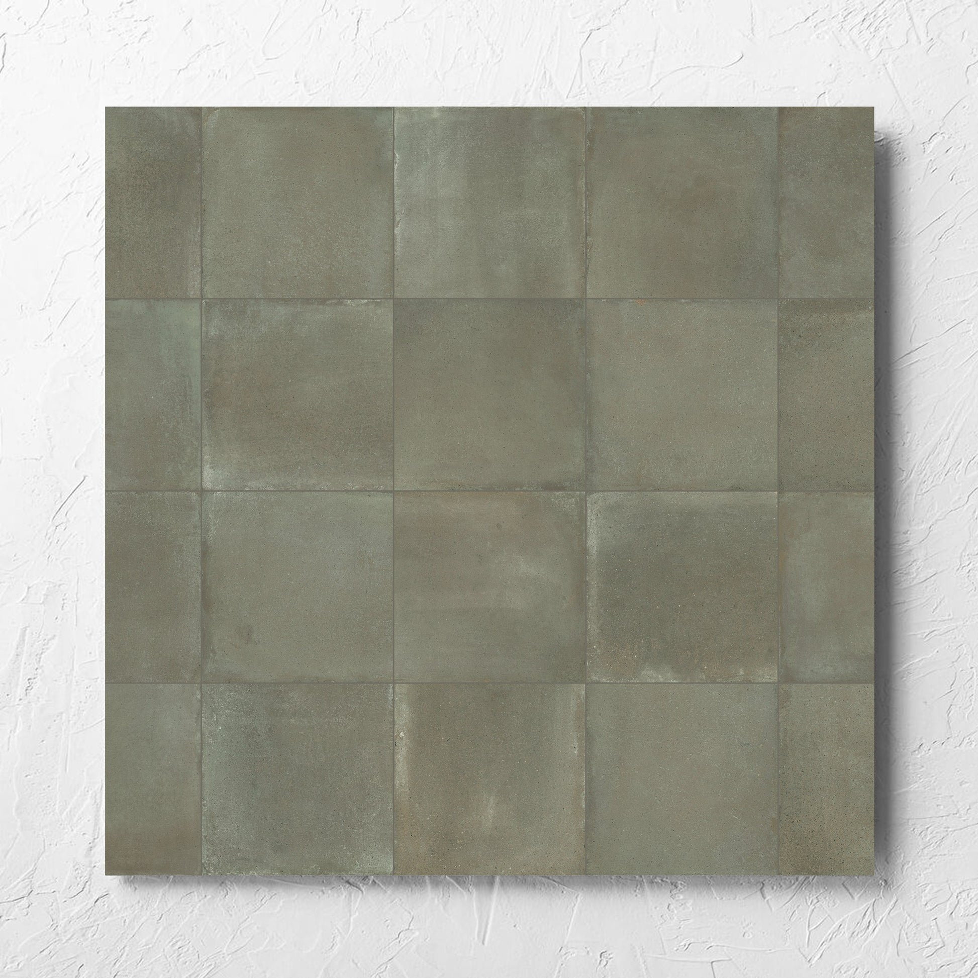 Cotto Khaki Matt 600x600mm tile laid flat on a white rendered wall, showing the matt surface