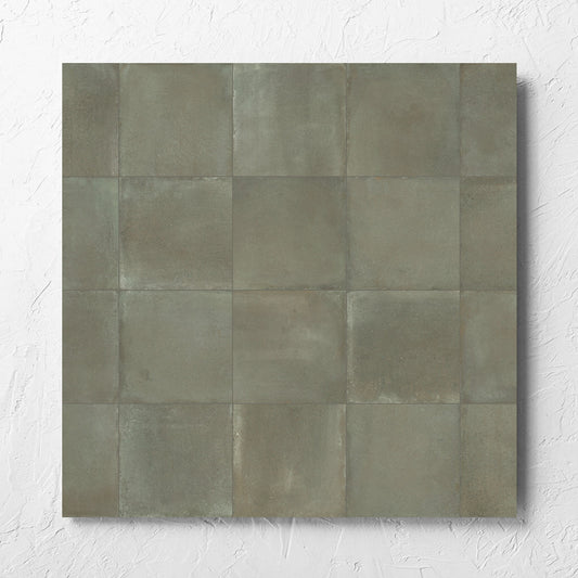 Cotto Khaki Matt 600x600mm tile laid flat on a white rendered wall, showing the matt surface