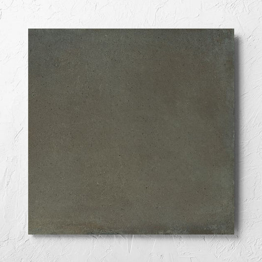 Cotto Khaki Matt 600x600mm tile laid flat on a white rendered wall, showing the matt surface