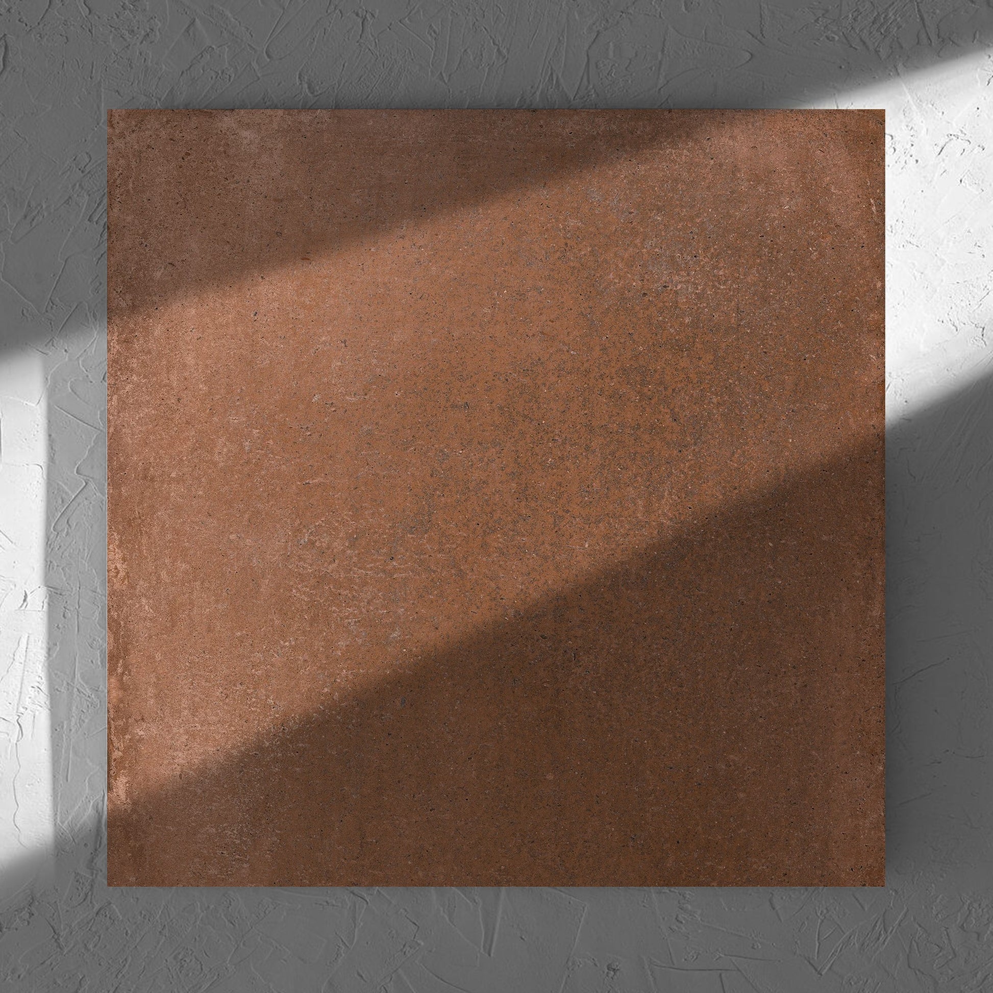 Cotto Terra Matt 600x600mm tile in soft natural window light, showing the matt surface