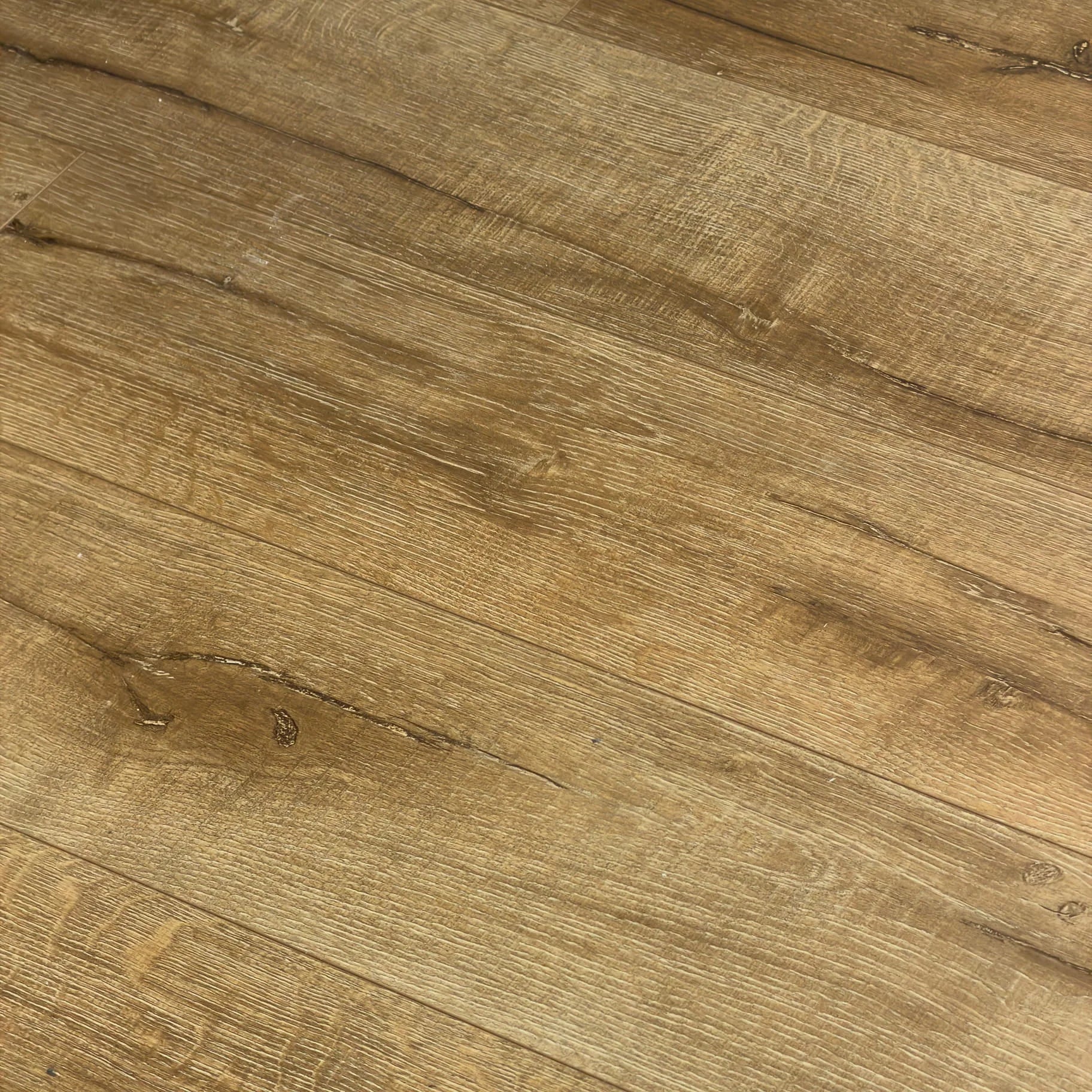 Close-up texture shot of Country Oak Urban Laminate 12mm Flooring 12mm showing warm brown wood grain, natural knots, and fine surface detail.