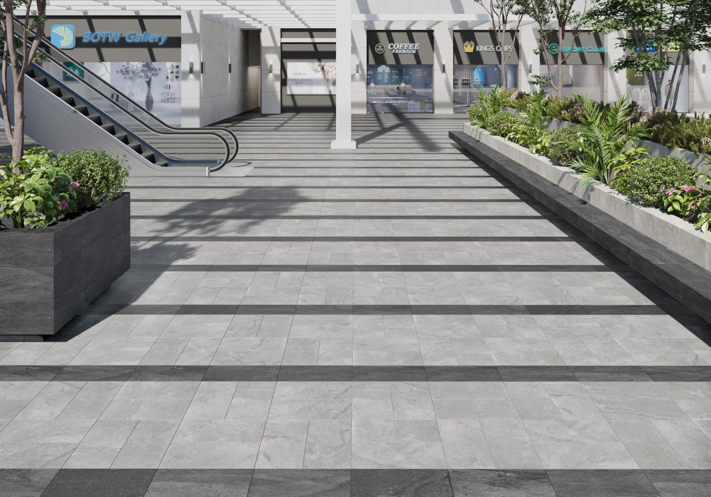 Courtyard Anthracite Matt 300x600mm tiles used as dark step nosings and risers on wide outdoor plaza stairs flanked by lush planters and retail shopfronts.