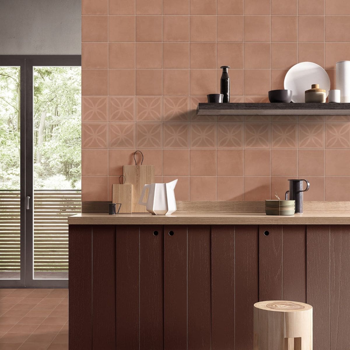 Craft Art 3D Cotto 200x200mm terracotta wall tiles with embossed geometric band installed in a modern kitchen behind a dark wood island unit and open shelf.