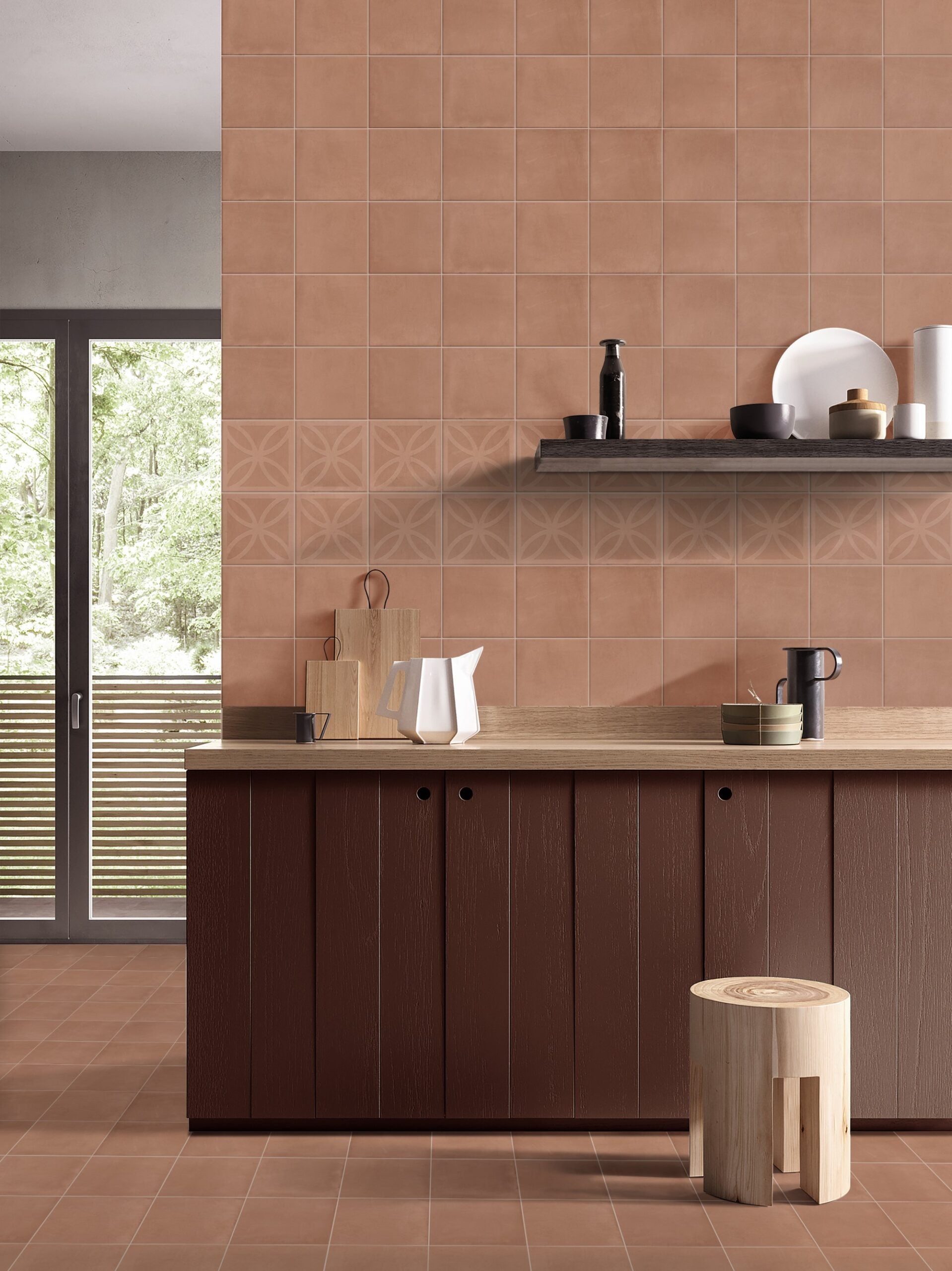 Craft Art Cotto 200x200mm terracotta tiles covering a kitchen wall and floor, paired with dark wood cabinetry, a floating shelf, and decorative patterned tile band.