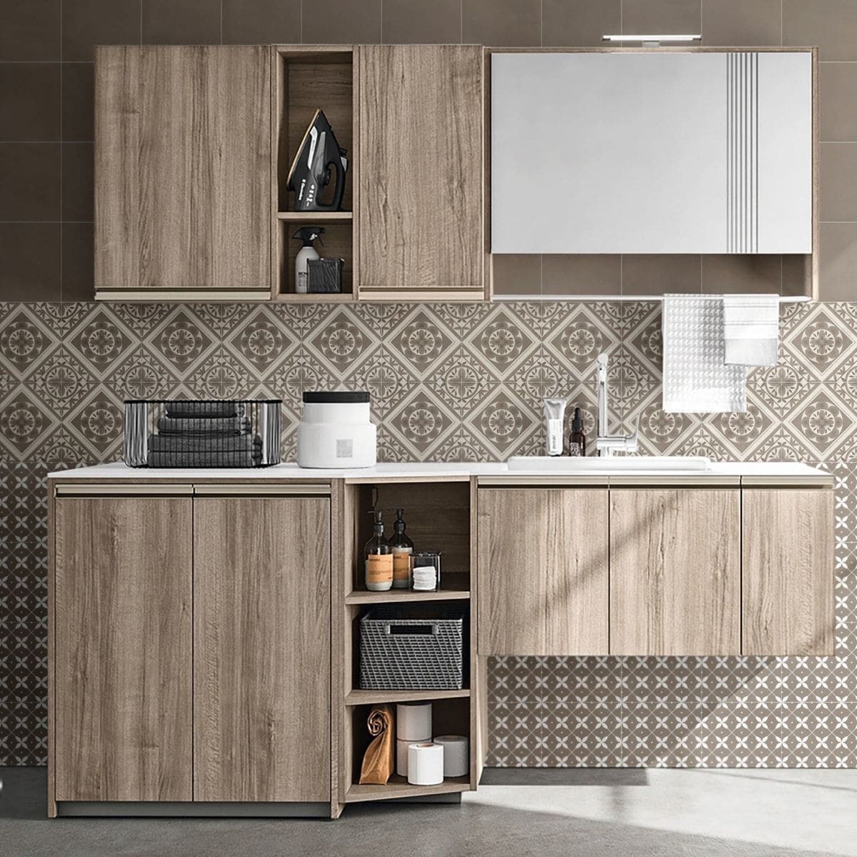 Craft Art Leaf Earth 200x200mm patterned wall tiles installed as a splashback and floor in a modern laundry room with timber cabinetry and a wall-mounted sink.