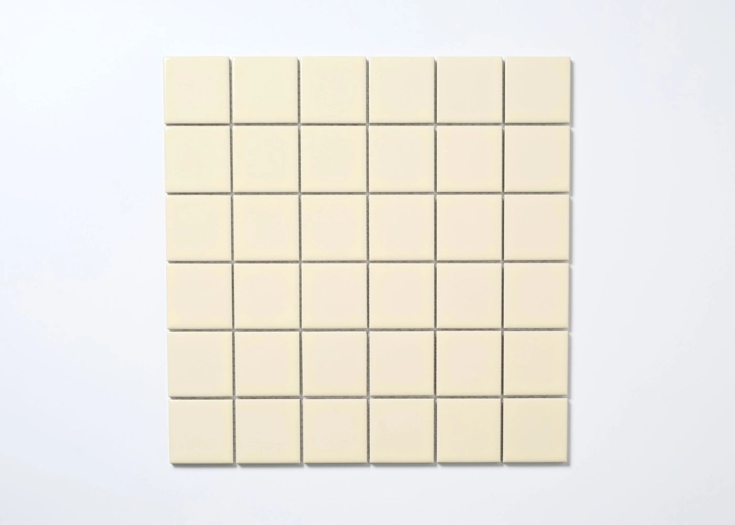 A flat lay pack shot of Cream Gloss Porcelain Glazed 48x48mm Square tiles arranged in a 6x6 mosaic sheet with fine grey grout lines.