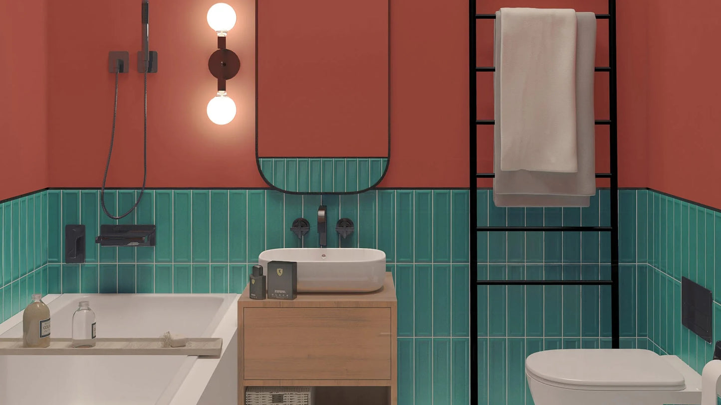 Edge Light Green Wave Matt 68x280mm tiles fitted as a half-height teal wainscot in a coral-painted bathroom with wooden vanity and black ladder towel rail.
