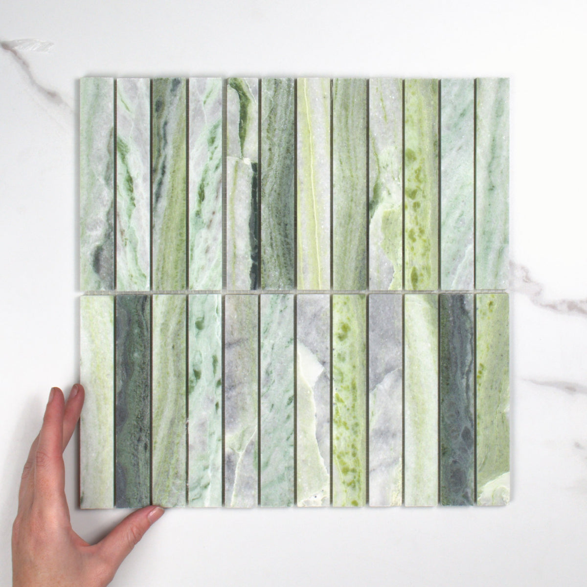 Elementa Cloud Emerald Finger Mosaic 23x148mm top view, hand for scale