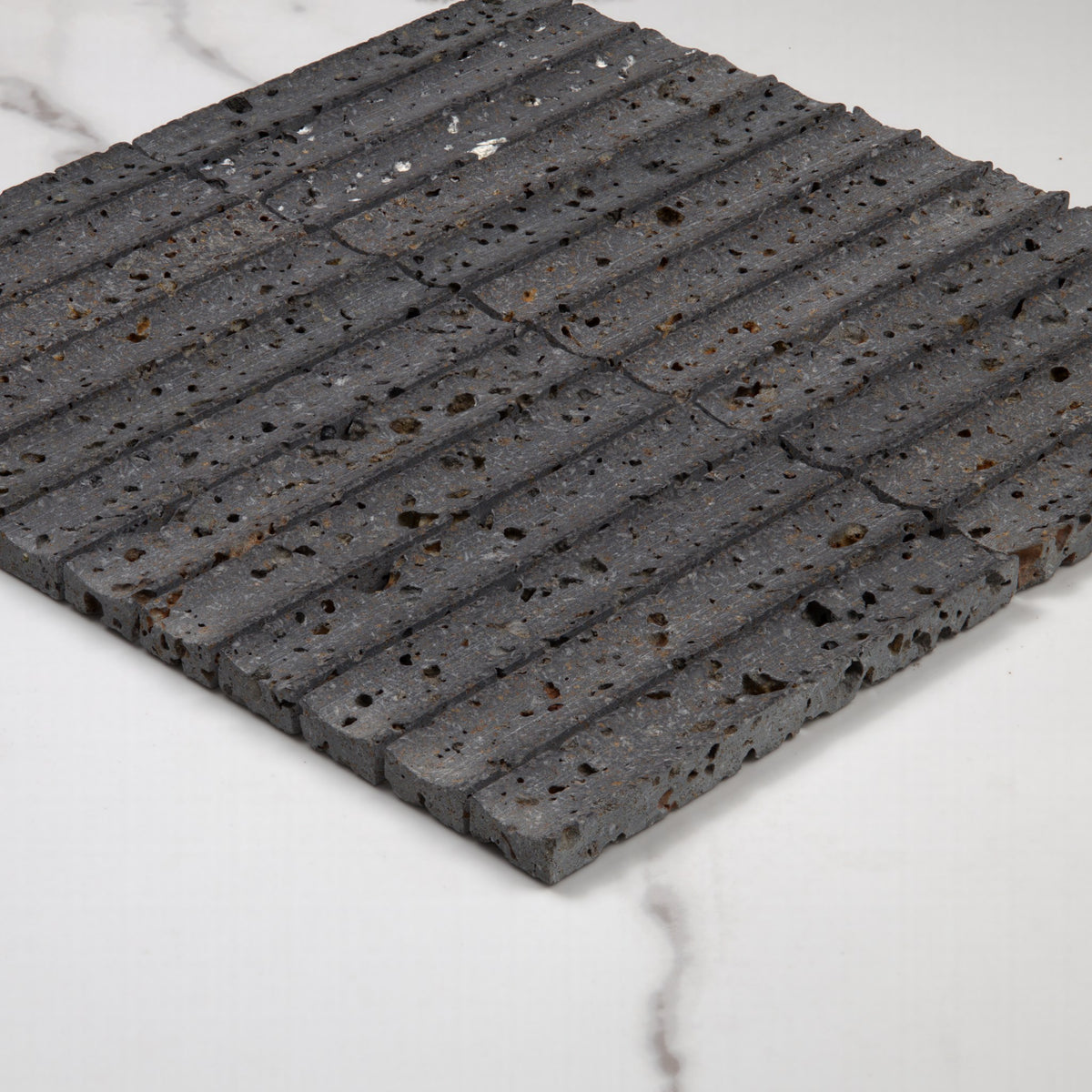 Elementa Travertine Black Concave Mosaic 23x148mm angle view