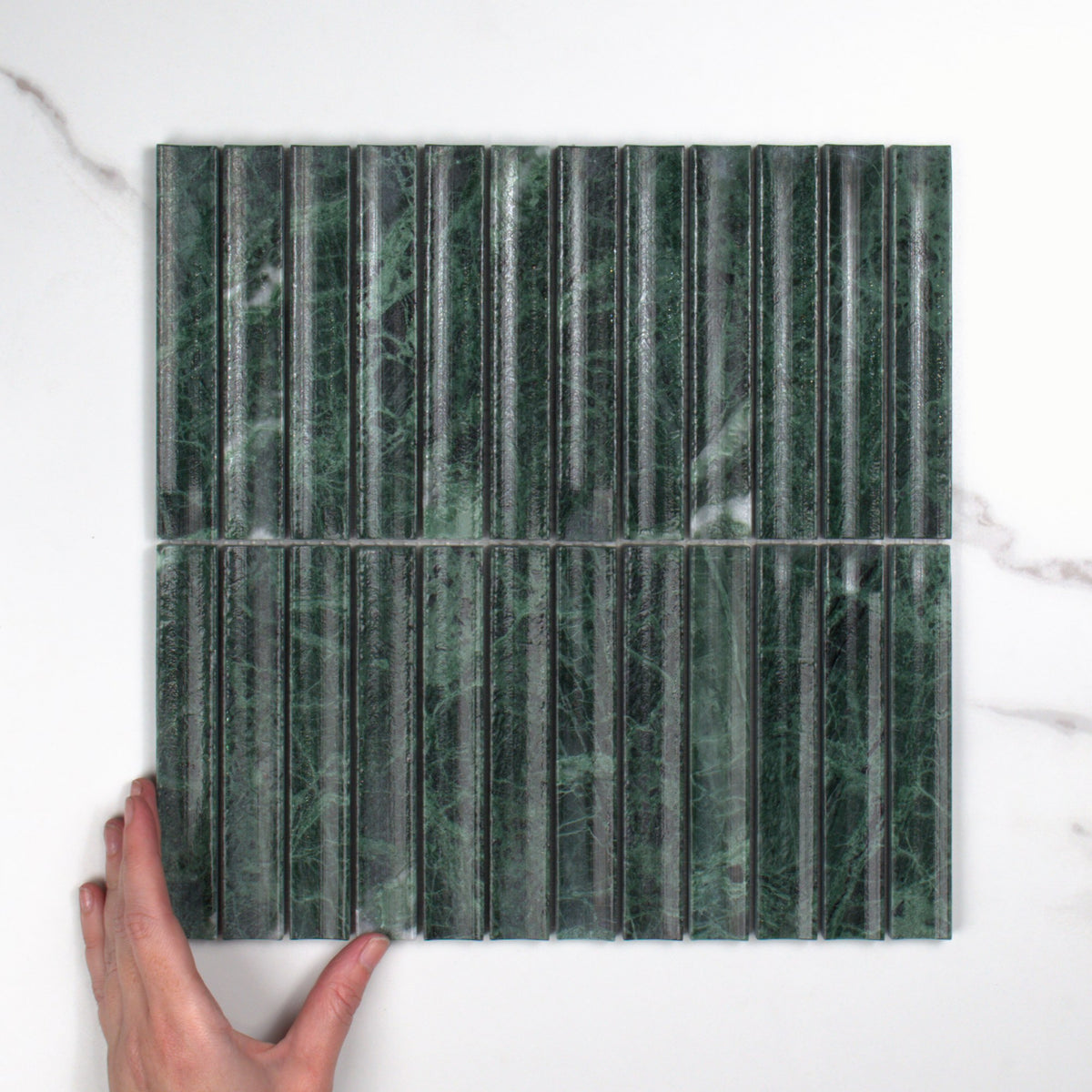 Elementa Verdi Alpi Concave Mosaic 23x148mm top view, hand for scale
