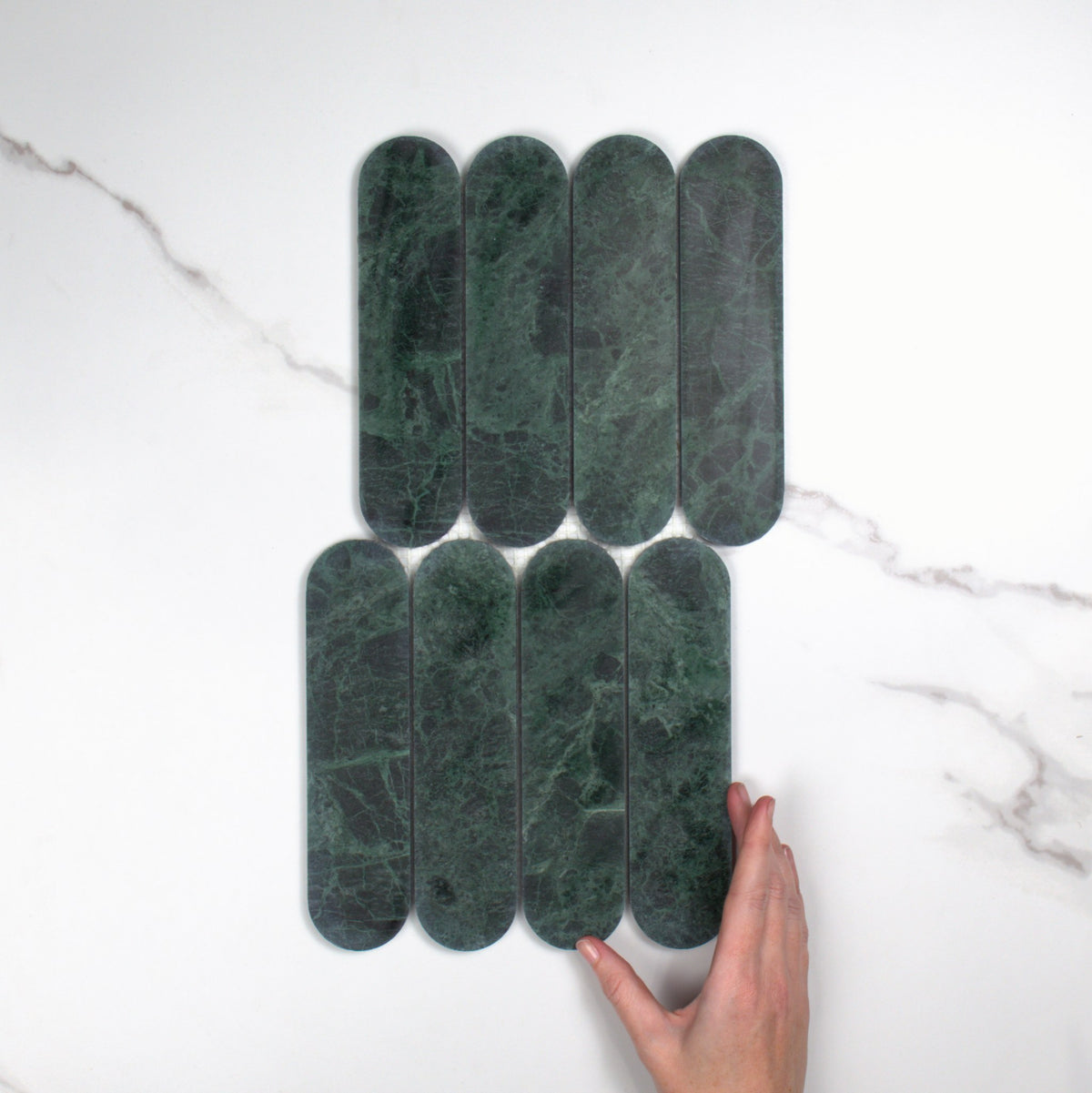 Elementa Verdi Alpi Cylinder Mosaic 50x198mm top view, hand for scale
