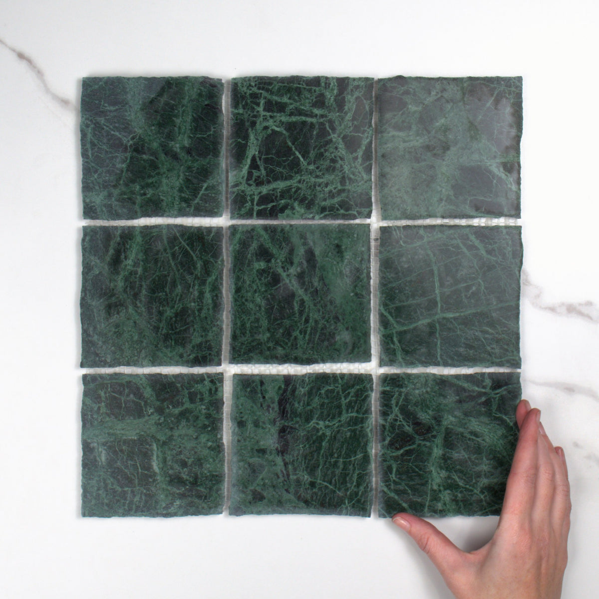 Elementa Verdi Alpi Mosaic 100x100mm top view, hand for scale