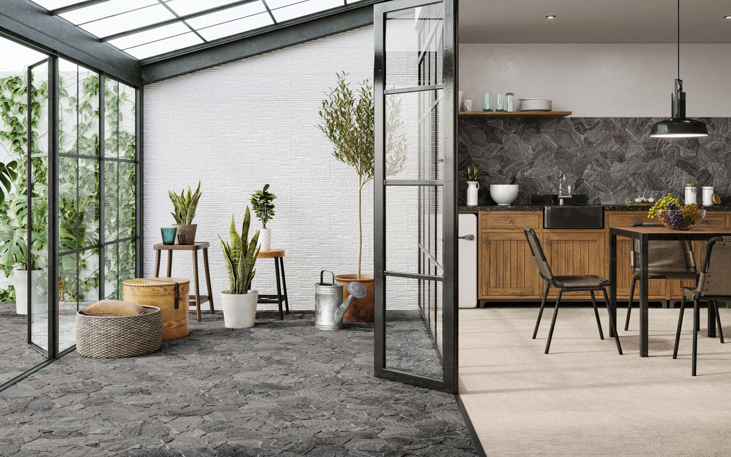 Esla Flagstone 440x660mm dark grey irregular stone-look tiles installed across a sunlit conservatory floor and kitchen splashback, styled with potted plants and timber cabinetry.