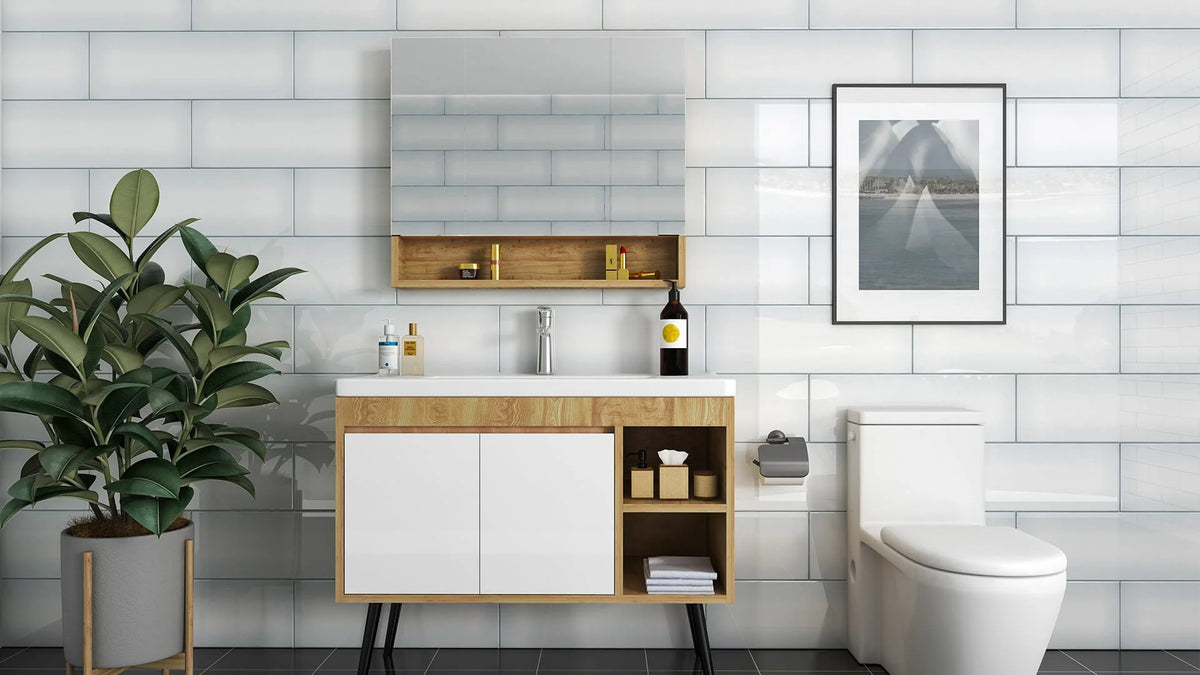 Fade Grey Gloss Unrectified 200x603mm subway tiles covering a full bathroom wall behind a timber and white vanity unit with mirror cabinet and toilet.