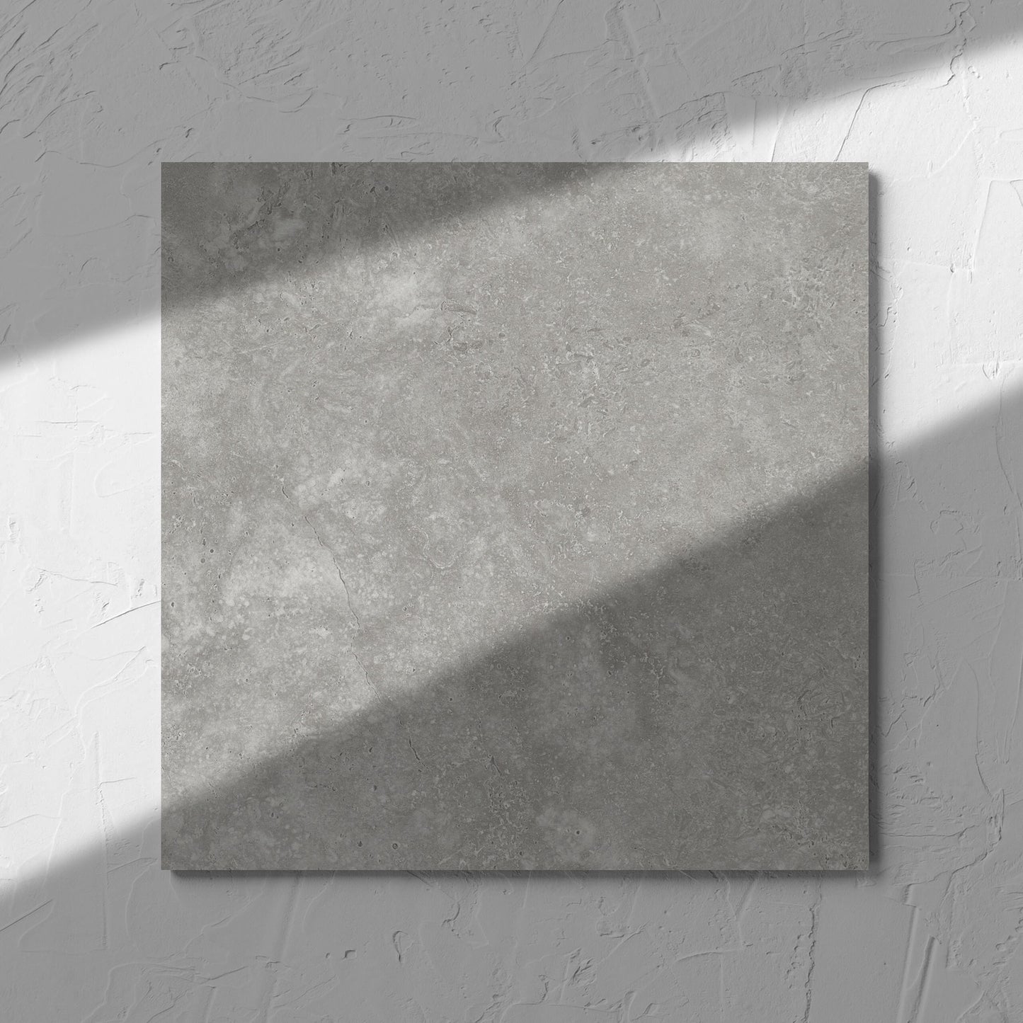 Fossil Stone Pebble Matt 300x300mm tile in soft natural window light, showing the matt surface