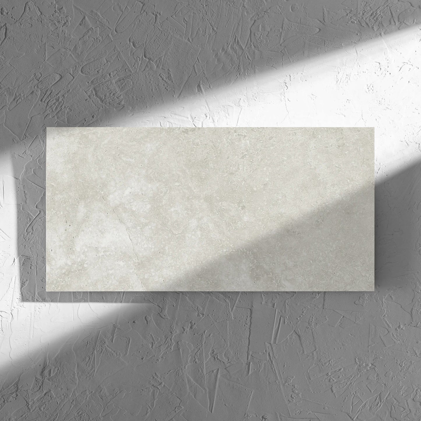 Fossil Stone Sand Matt 300x600mm tile in soft natural window light, showing the matt surface