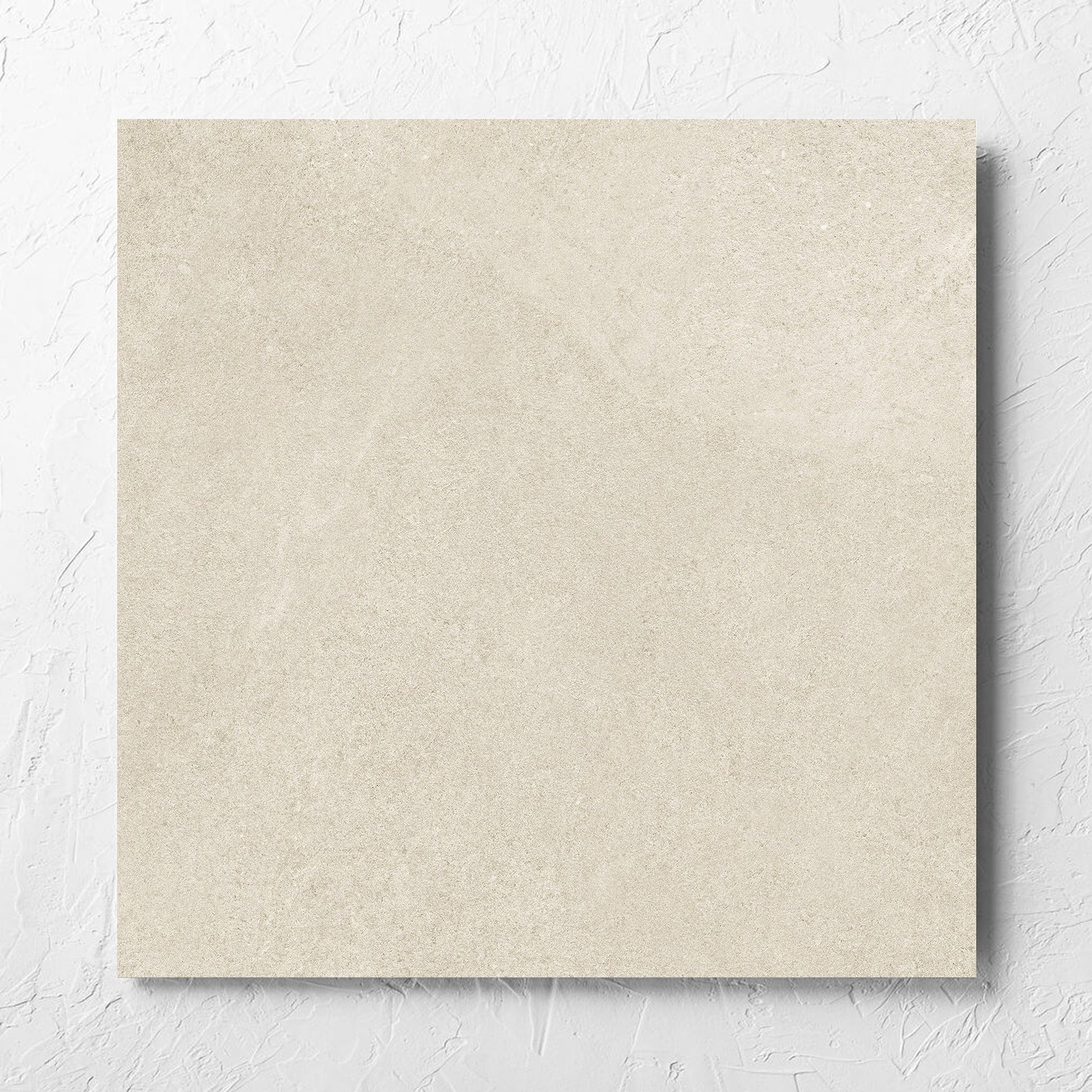 Fusion Beige Ultra Tech 600x600mm tile laid flat on a white rendered wall, showing the matt surface