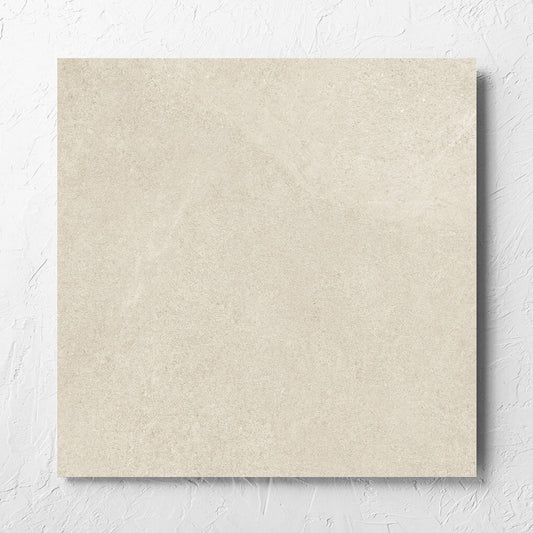 Fusion Beige Ultra Tech 600x600mm tile laid flat on a white rendered wall, showing the matt surface