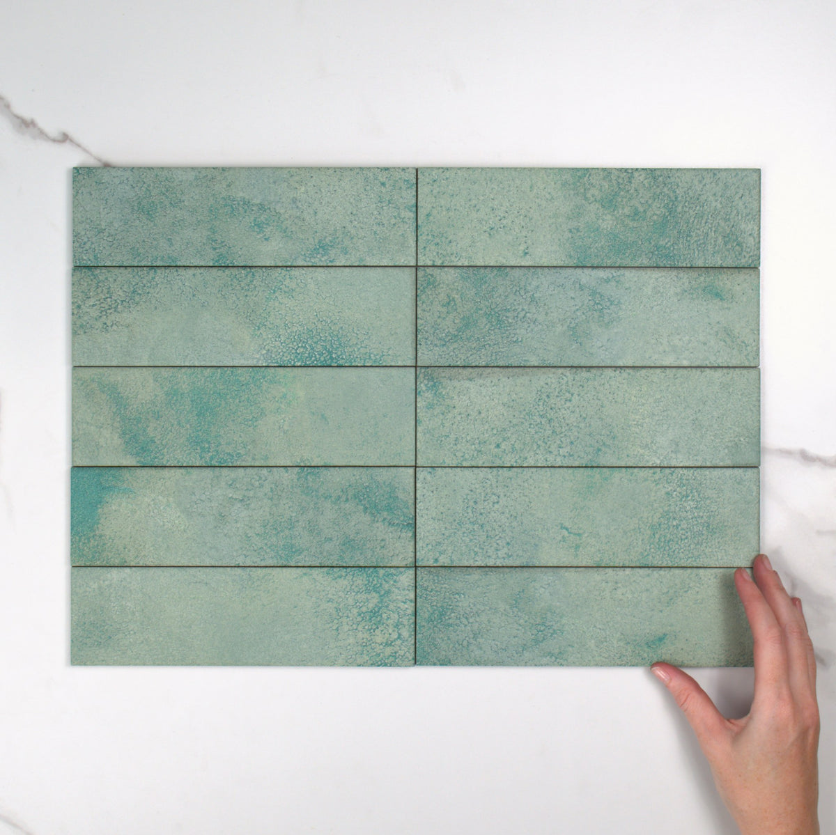 Greenland Boreal Matt 64x223mm top view, hand for scale