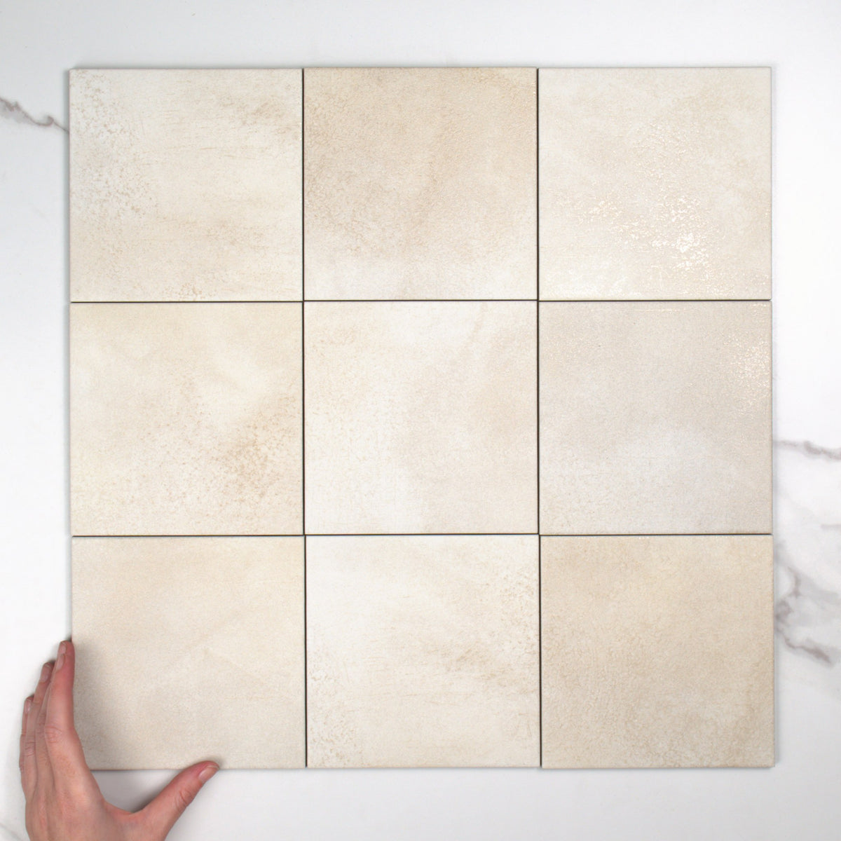 Greenland Clay Anti-Slip 147x147mm top view, hand for scale
