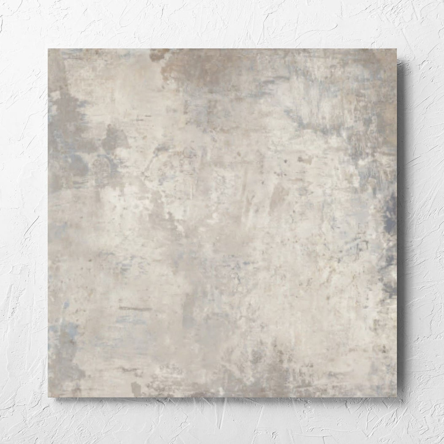 Grunge Beige Rectified 600x600mm tile laid flat on a white rendered wall, showing the tile surface