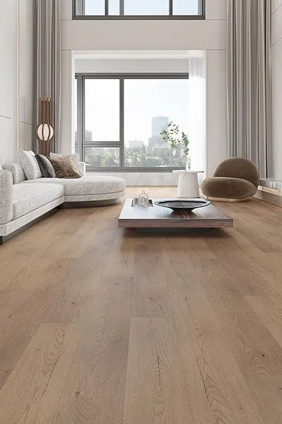 Harbour Grey Elegant SPC Hybrid 6.5mm Flooring 5+1.5mm installed in a bright modern living room with a white sectional sofa and floor-to-ceiling windows.