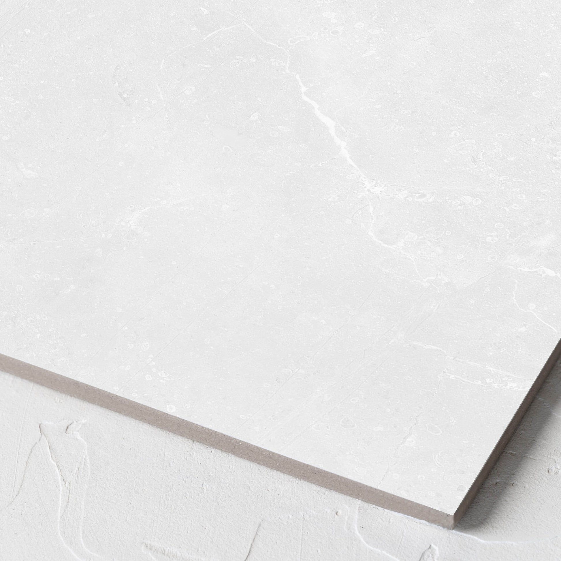 Corner close-up of the Kashmir Bone Matt 300x300mm tile showing the matt surface and the edge profile