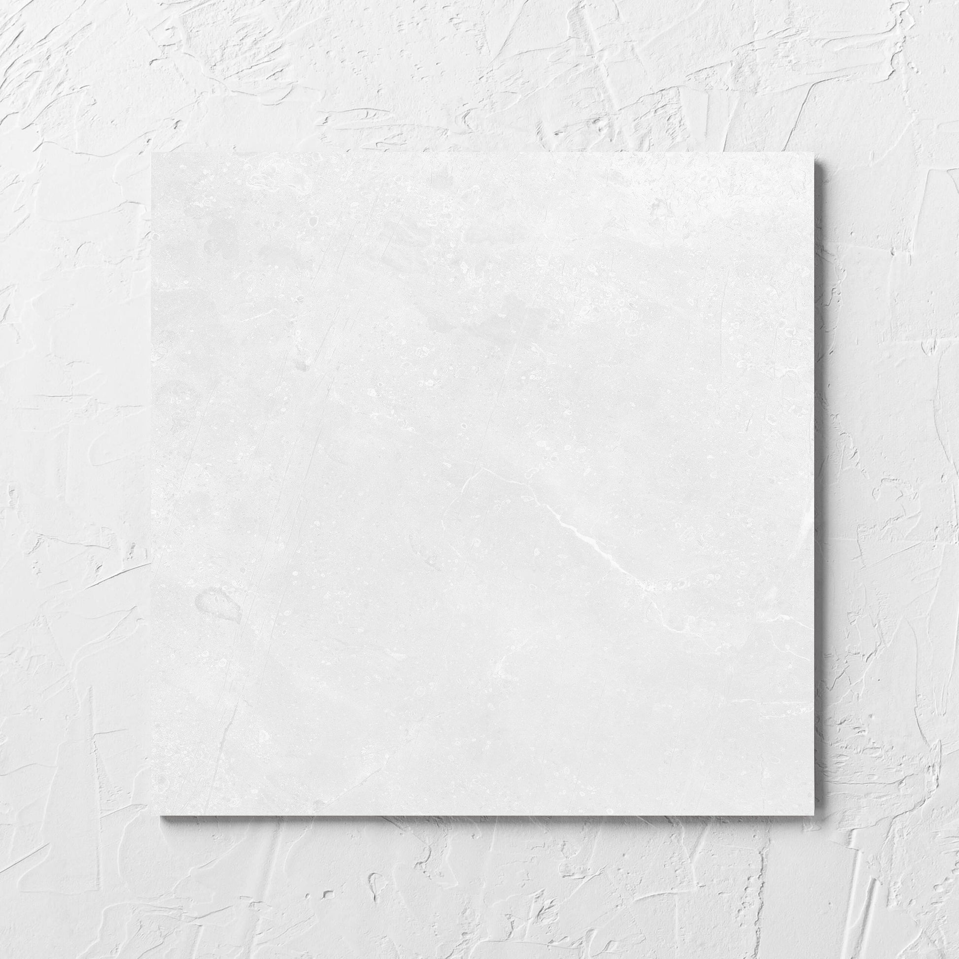 Kashmir Bone Matt 300x300mm tile laid flat on a white rendered wall, showing the matt surface