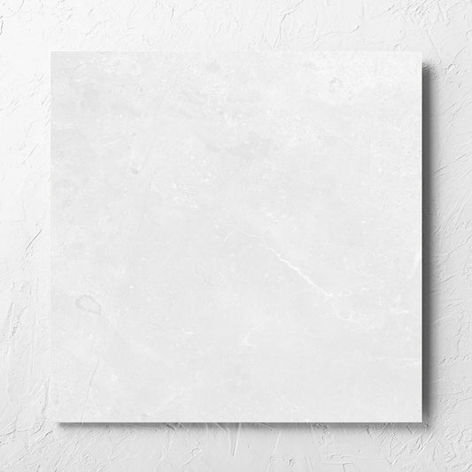 Kashmir Bone Matt 600x600mm tile laid flat on a white rendered wall, showing the matt surface